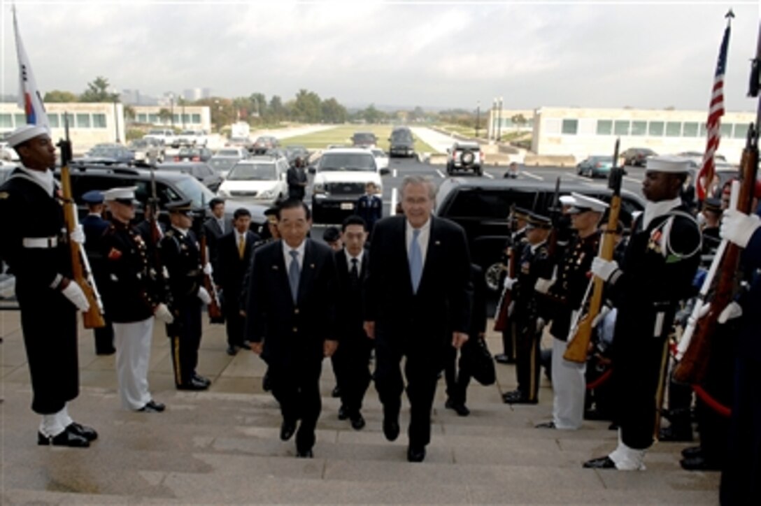Secretary of Defense Donald H. Rumsfeld escorts the Korean Minister of National Defense Yoon Kwang Ung through a cordon of honor guards and into the Pentagon, Oct. 20, 2006. The two defense leaders meet for the 38th Annual Republic of Korea and United States Security Consultative meetings.