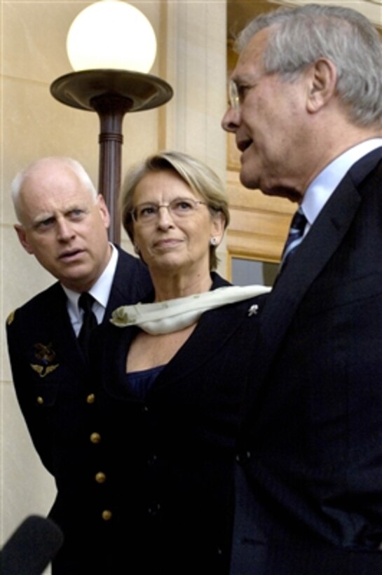 Secretary of Defense Donald H. Rumsfeld (right) and French Minister of Defense Michelle Alliot-Marie (2nd from right) speak to the press after their Pentagon meeting on Oct. 19, 2006.  Rumsfeld and Alliot-Marie discussed a comprehensive range of international security issues.  