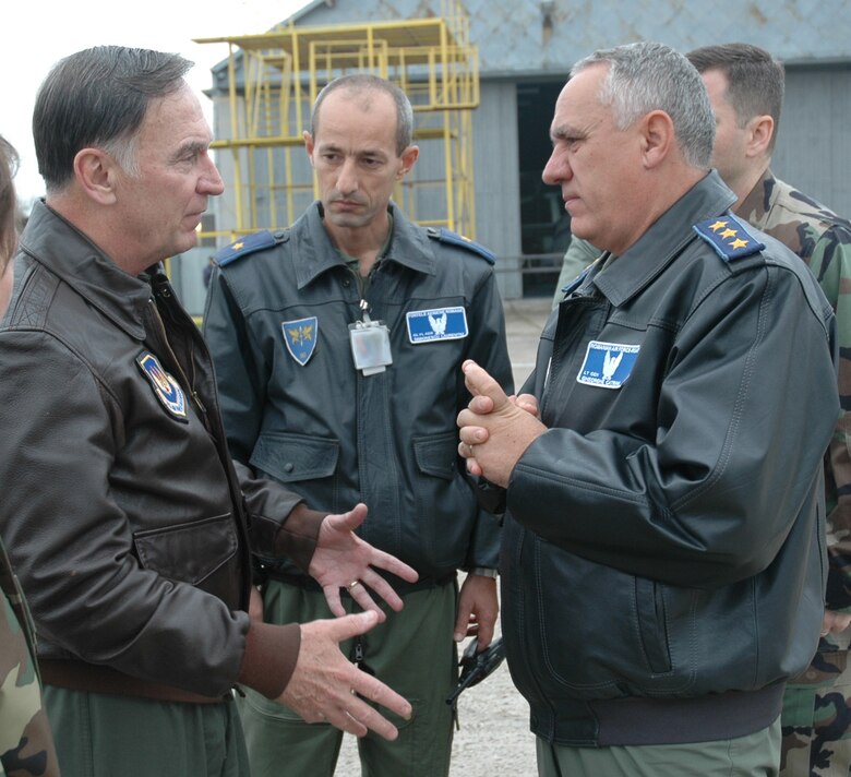 Gen. Tom Hobbins (left) discusses training options with Romanian Air Force Chief of Staff Lt. Gen. Gheorghe Catrina (right) and Air Flotilla General Simonescu Laurentin during a visit to Fetesti Air Base, Romania, Oct. 20. General Hobbins is the U.S. Air Forces in Europe commander. (U.S. Air Force Photo/Capt. Elizabeth Culbertson) 
