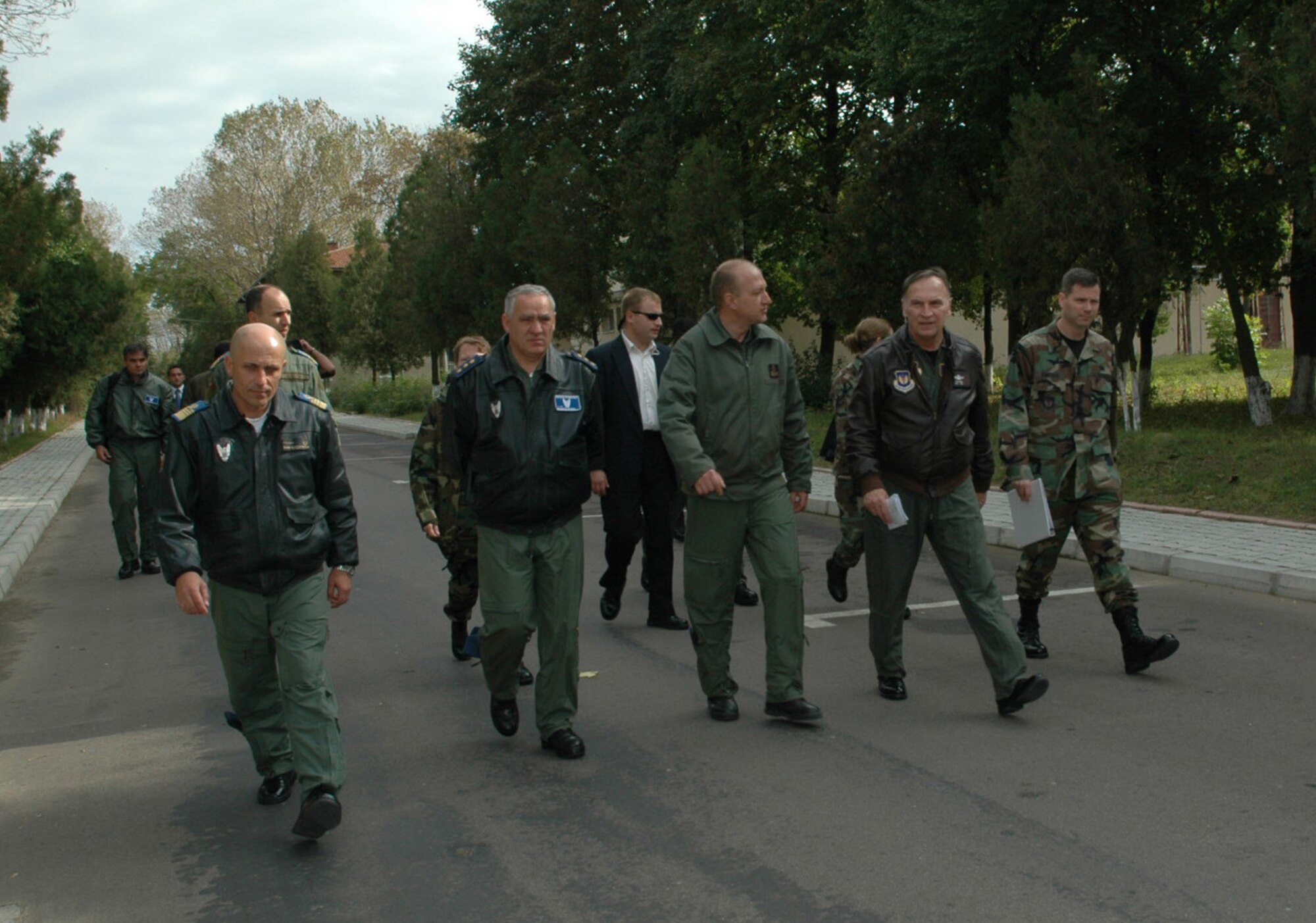 FETESTI AIR BASE, Romania--Gen. Tom Hobbins (second from right), U.S. Air Forces in Europe commander, and (from left) Cmdr. Dan Buciuman, Fetesti Air Base commander, Lt. Gen. Gheorghe Catrina, Romanian Air Force Chief of Staff, Captain Cmdr. Adrian Vasile, Festesti AB vice commander and Maj. David Simpson, USAFE plans and programs, tour Mihail Kogalniceanu Air Base Oct. 20. The air base has several projects underway for the base's use as a U.S. forward operating site. (U.S. Air Force Photo/Capt. Elizabeth Culbertson)