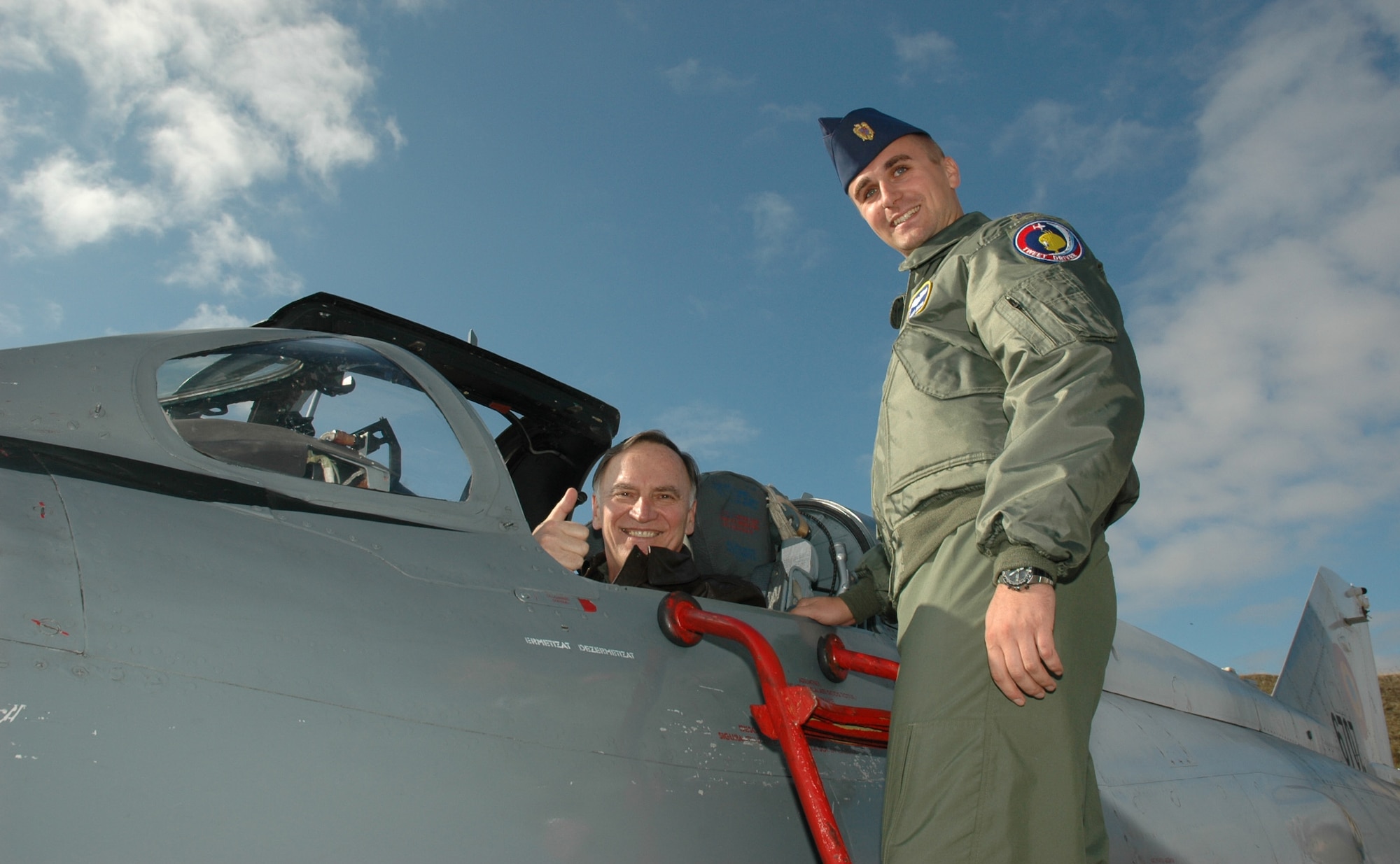 FETESTI AIR BASE, Romania--Gen. Tom Hobbins, U.S. Air Forces in Europe commander, receives an orientation briefing to a MiG-21 by Romanian First Lieutenant Mihaita Marin during the general's base visit Oct. 20. (U.S. Air Force Photo/Capt. Elizabeth Culbertson)