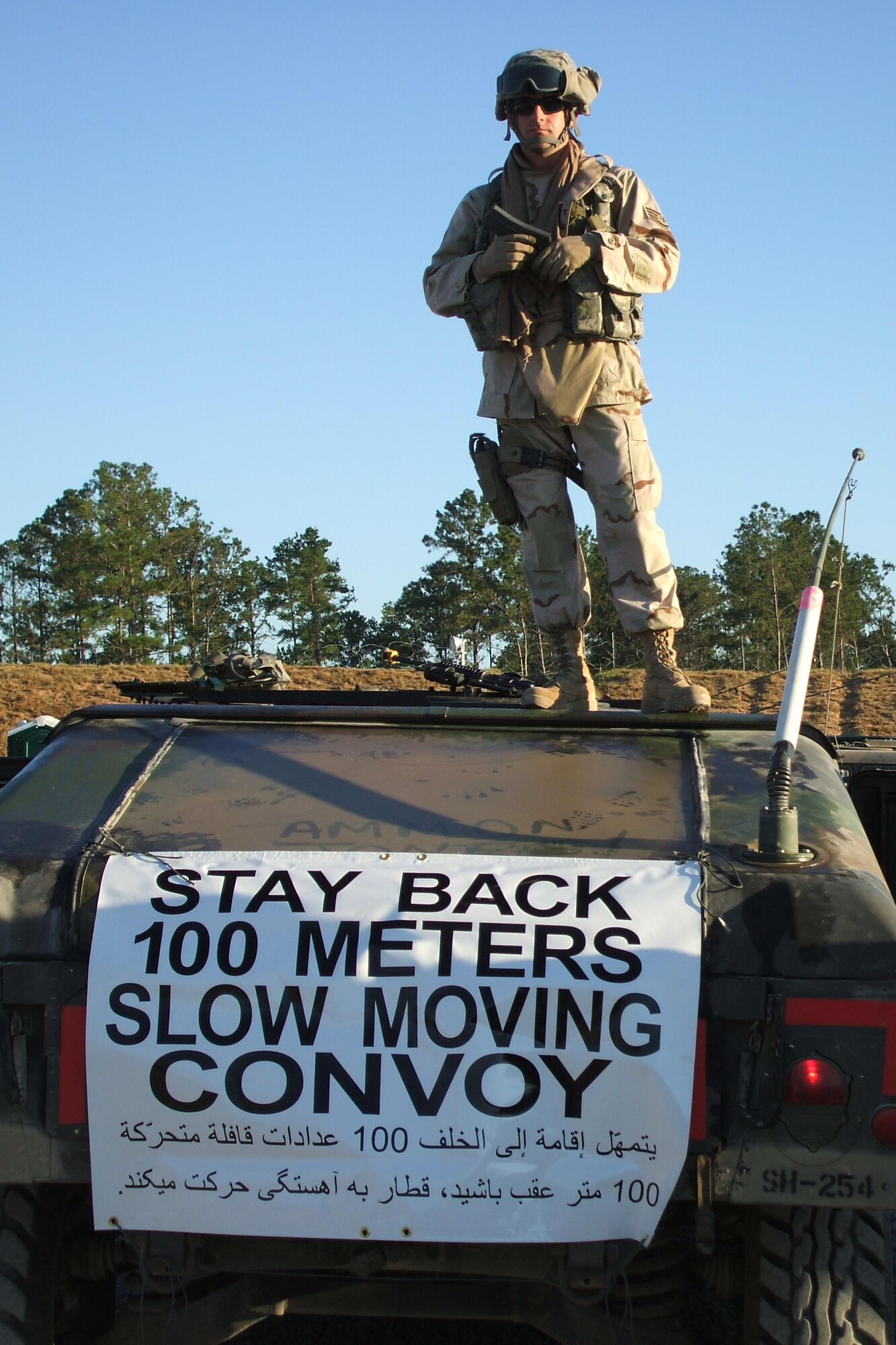 Staff Sergeant Kelly Summerfield, 90th Missile Maintenance Squadron, poses on top of a HMMVV used in convoy training at Camp Shelby, Miss. Sergeant Summerfield is deploying to Kandahar, Afghanistan.