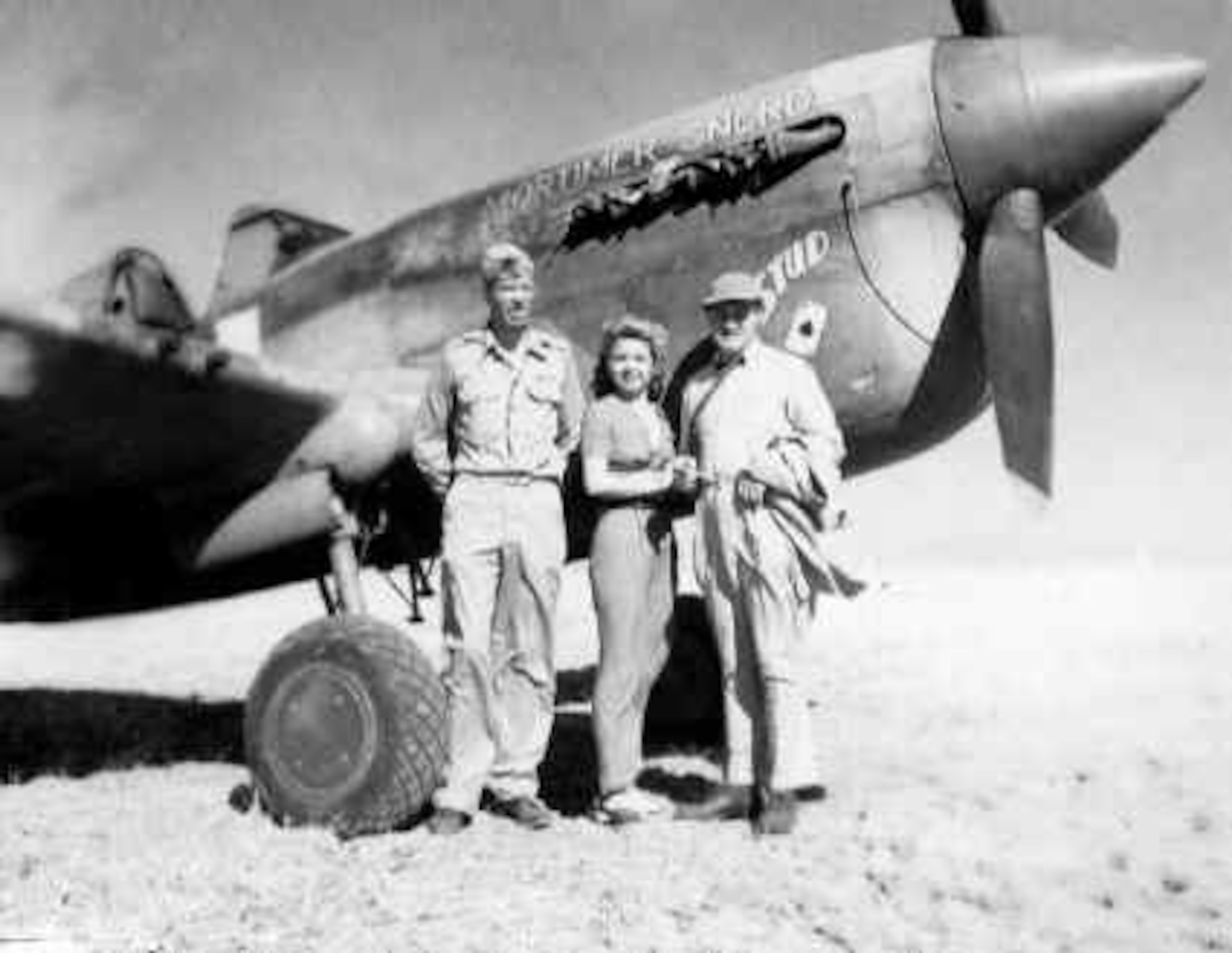Col. Bob Baseler, 325th Fighter Group commander, poses in front of his P-40, "Stud",   with singer Frances Langford and comedian Bob Hope.  Hope, Langford, and others made a USO tour of North Africa, visiting the 325th Fighter Group on Aug. 10, 1943.