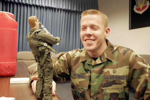 Senior Airman Jeffrie Mayberry, 366th Aeromedical Dental Squadron, watches as Viper prepares to administer his influenza vaccination Tuesday morning in Building 512. The 366th ADS is currently administering the mist to small squadrons and will begin giving the mist to larger squadrons shortly. The vaccination is mandatory for active-duty personnel to prepare for the upcoming flu season. (Photo by Senior Airman Brian Stives)



