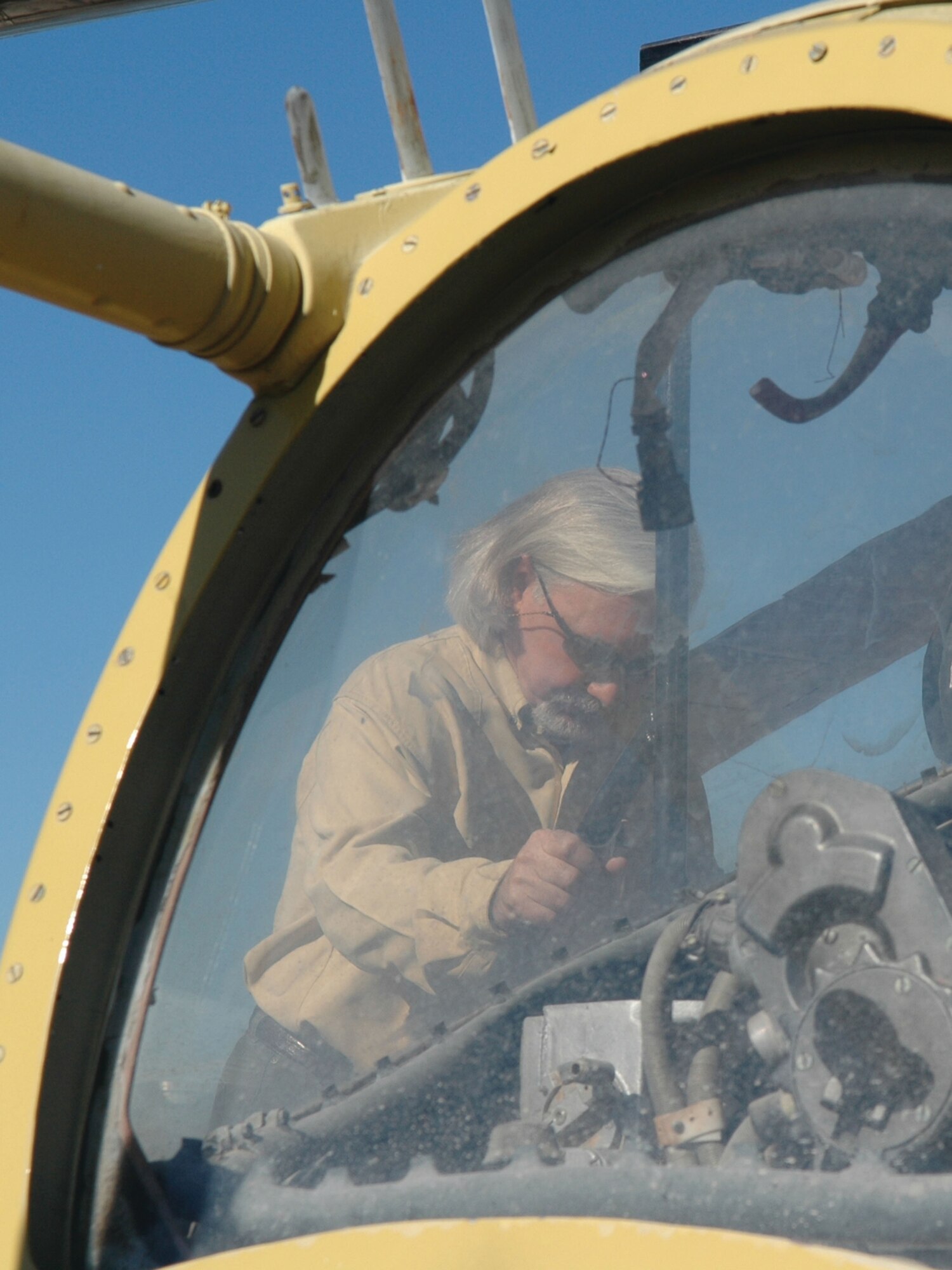 Kevin Byram, Heritage Energy Company vice president, looks into the cockpit of an aircraft parked in the “petting zoo,” a boneyard located at the threat training facility full of foreign military hardware acquired by the U.S. military over the years. Mr. Byram and approximately 30 other civic leaders from  Shreveport-Bossier and surrounding areas visited Nellis AFB, Nev., Oct. 11-12 as part of the 917th Wing Civic Leader Tour 2006. While there, these community leaders learned about the missions of the Predator, the F-22A Raptor and the Thunderbird aircraft. They were briefed on how the total force mission works, where active-duty and associate Reserve units work as one team. (U.S. Air Force photos/Tech. Sgt. Sherri Savant)