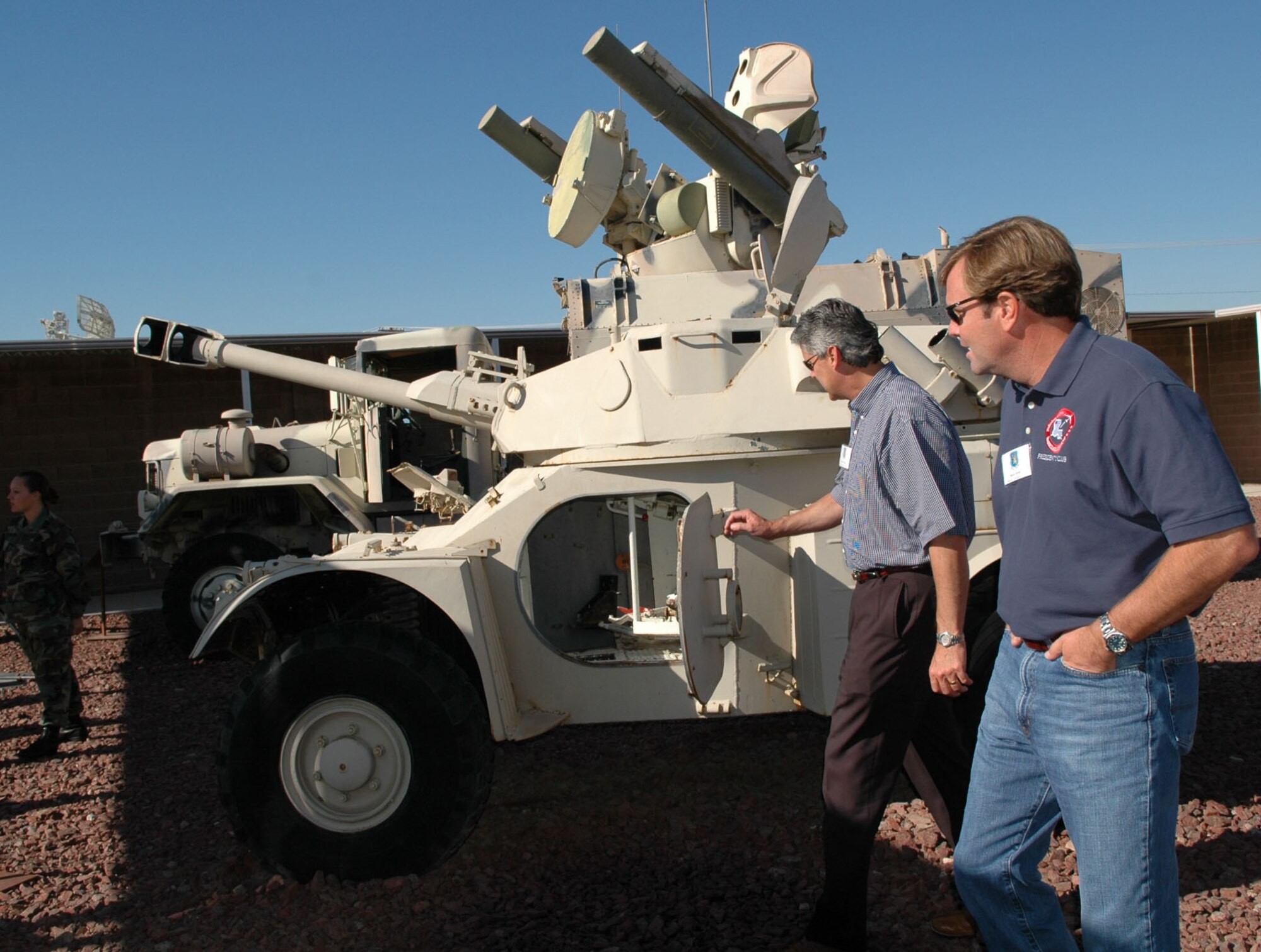 Steve Scott, Houston oil and gas company, and Tommy Clark, Bossier Chamber of Commerce vice president of government affairs, walk through the "petting zoo" at the threat training facility at Nellis AFB, Nev., Oct. 12. Civic leaders from Shreveport Bossier and surrounding areas visited Nellis Oct. 11-12 to learn more about the Air Force mission. (U.S. Air Force photo/Tech. Sgt. Sherri Savant)