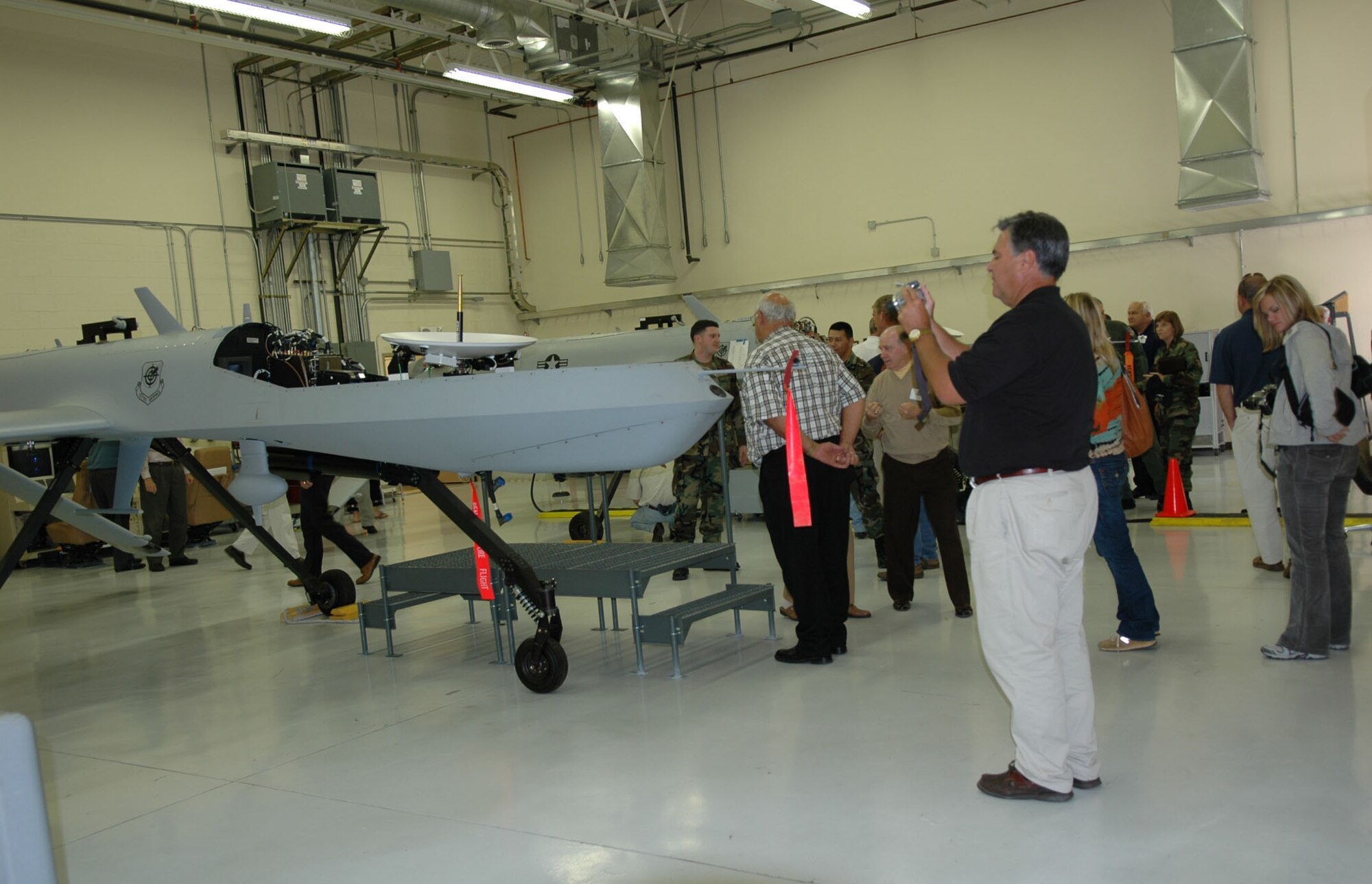 Civic leaders get a close-up look at a Predator aircraft while on the Wing civic leader tour Oct. 11-12 at Nellis AFB, Nev. (U.S. Air Force Photo/Tech. Sgt. Sherri Savant)