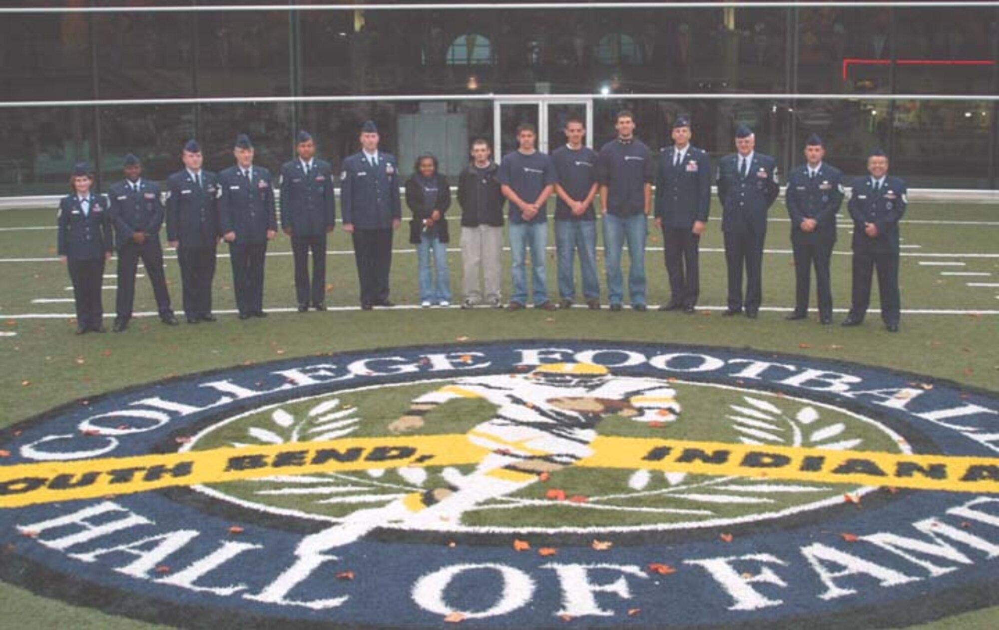 GRISSOM AIR RESERVE BASE, Ind -- Recruiters and enlistees stand on the College Football Hall of Fame field during a mass enlistment ceremony held Oct. 19 on the Notre Dame campus, South Bend, Ind.  Each October, Grissom recruiters hold a mass enlistment at a special location to kick-off the new recruiting year.  (U.S. Air Force photo\Senior Airman Mark Orders-Woempner)