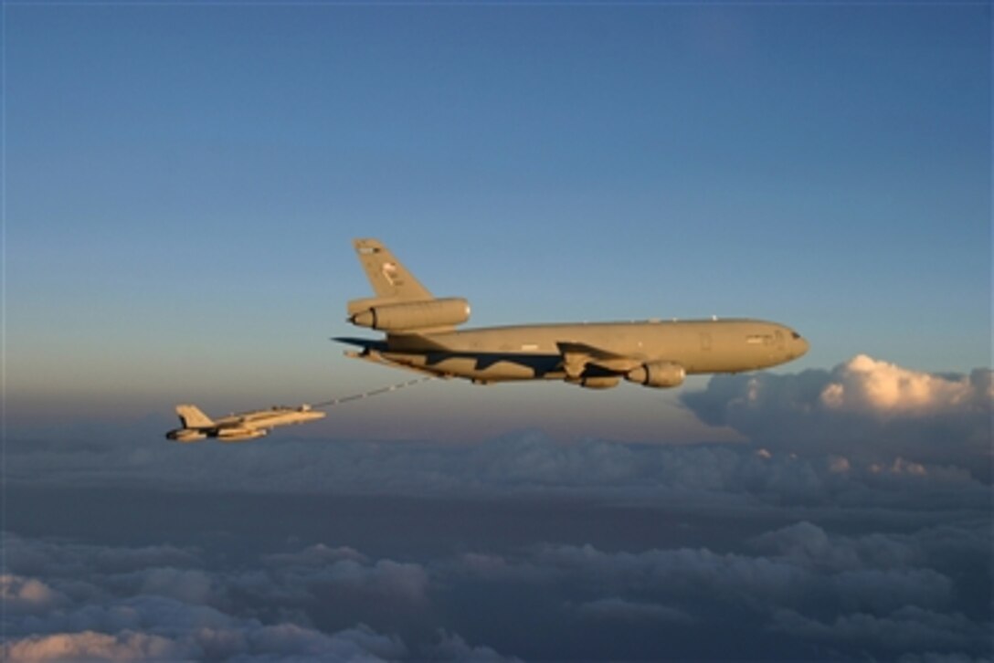 An F/A-18C Hornet aircraft (left) receives fuel from a KC-10 Extender aircraft during a close air support mission over Afghanistan on Oct. 15, 2006.  