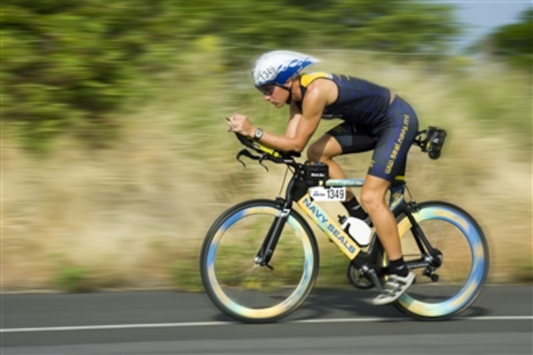 U.S. Navy SEAL Mitch Hall, assigned to Naval Special Warfare Center, tests his racing bike in Kona, Hawaii one day prior to the Ironman Triathlon, Oct. 20, 2006. The bike and Hall's racing suit were provided by Commander, Naval Recruiting Command to aid in SEAL (Sea, Air, Land) recruiting.