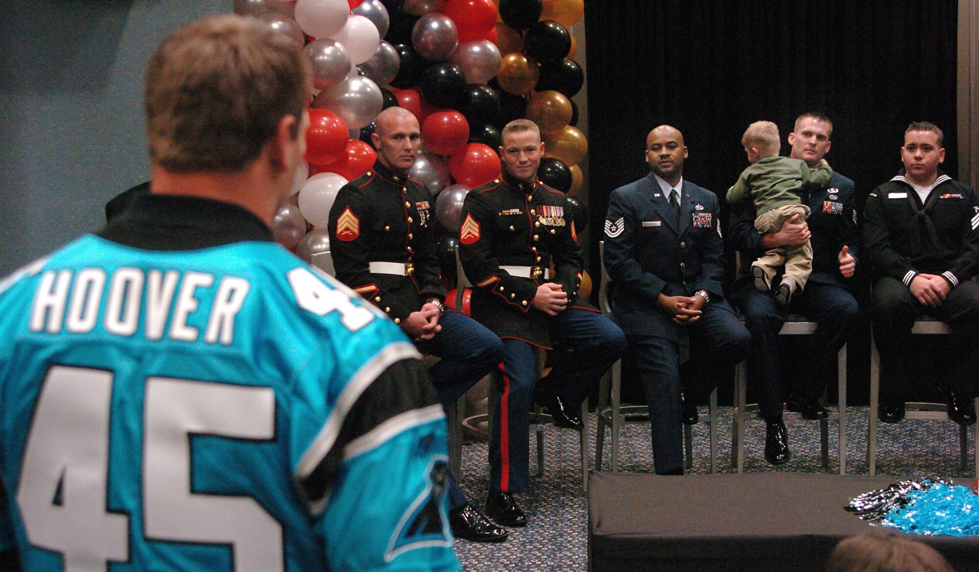 Carolina Panther Brad Hoover asks a question about life after returning from serving in Iraq or Afghanistan during Operation Welcome Home, inside the Bank of America Stadium, Charlotte N.C., on Oct. 24. Home allowed military members from the Air Force, Army, Navy and Marines to tour the stadium and meet several players from the Carolina Panthers as a thank you after deploying in support or Operations Iraqi Freedom and Enduring Freedom. (U.S. Air Force photo/Tech. Sgt. Larry A. Simmons)