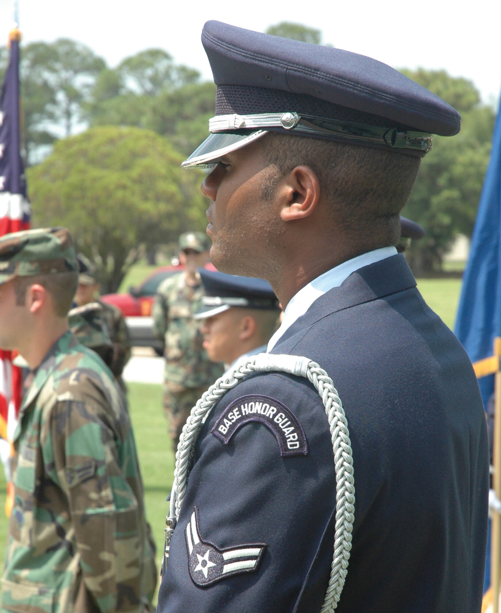 TYNDALL AFB, Fla. --  Airman 1st Class Michael Ward, 325th Aircraft Maintenance Squadron avionics technician and Honor Guard member, stands to recognize Tyndall's newest Honor Guard members at a graduation ceremony Aug. 18 here. (U.S. Air Force photo by 1st Lt. Amanda Ferrell)