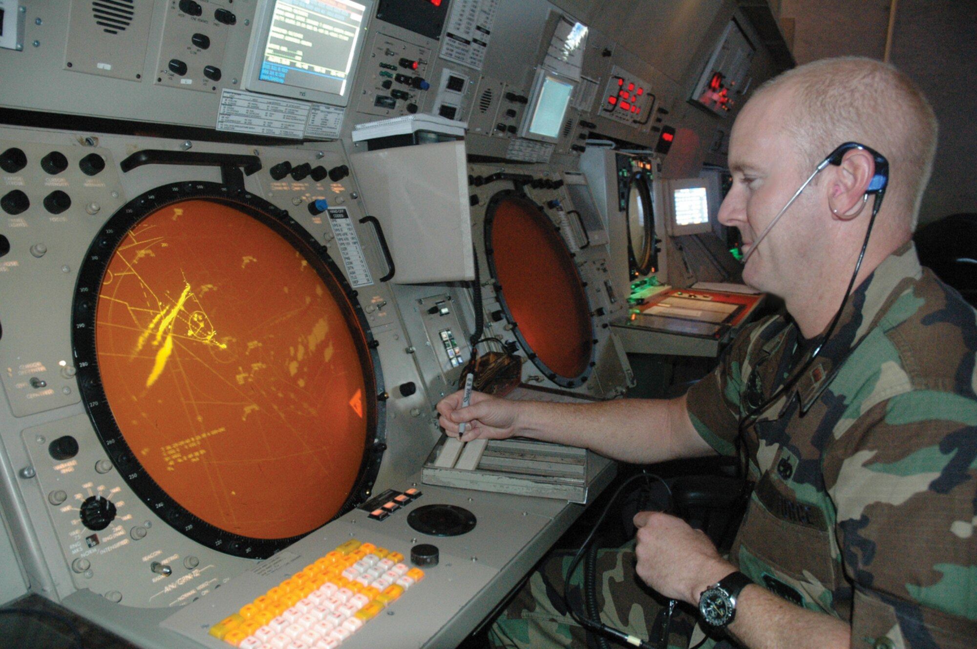 TYNDALL AFB, Fla. --  Second Lt. Charles Jesse, 325th Operations Support Squadron airfield operations officer, monitors live air traffic in the Radar Approach Control center here. (U.S. Air Force photo by 1st Lt. Amanda Ferrell)