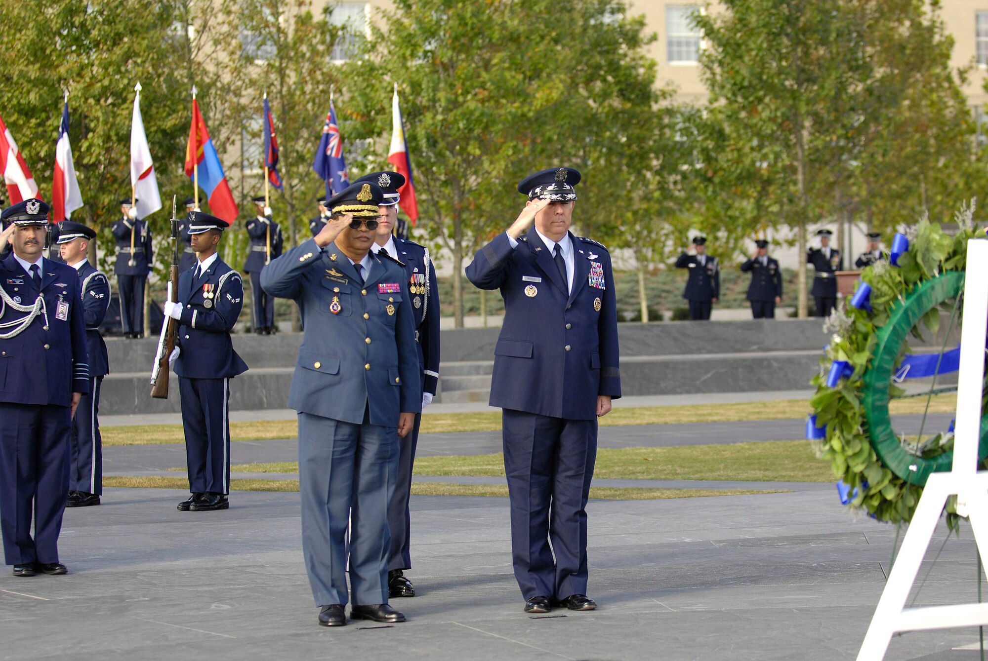 Air Force Chief of Staff Gen. T. Michael Moseley and Lt. Gen. Soeung Samnang salute during a foreign dignitary arrival and wreath-laying ceremony at the Air Force Memorial in Arlington, Va., on Tuesday, Oct. 24.  (U.S. Air Force photo/Senior Airman Desiree Andrejcik) 
