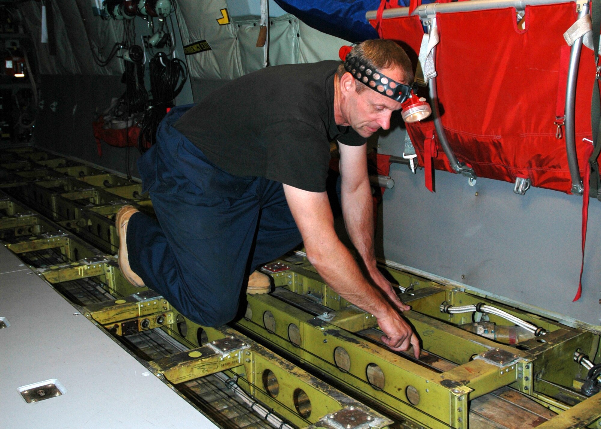 Air Force Reserve Technician, Tech. Sgt. Tom Ganss, 940th Maintenance Squadron aircraft repair technician, checks the flight and throttle cables on a KC-135T Stratotanker Oct. 24, 2006 at Beale Air Force Base, Calif.  The aircraft phase inspection takes nearly a month to check the jet from head to toe for wear and tear, but maintains integrity of the aircraft and helps ensure safe flying. (U.S. Air Force photo/Stacey Knott) 