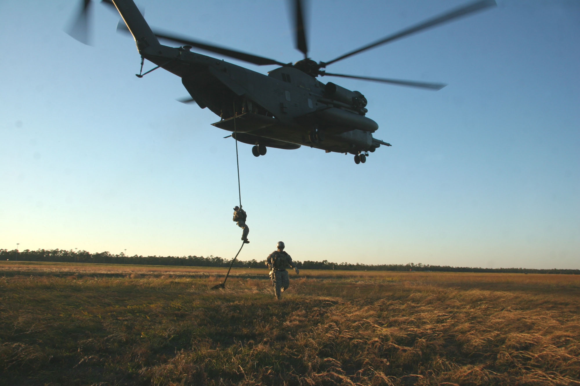 Green Berets practice "fast-roping" from the tail of an Air Force MH-53 Pave Low helicopter Oct. 23 at Hurlburt Field, Fla., in preparation for Exercise Emerald Warrior. (U.S. Army photo/Staff Sgt. Cain S. Claxton)
