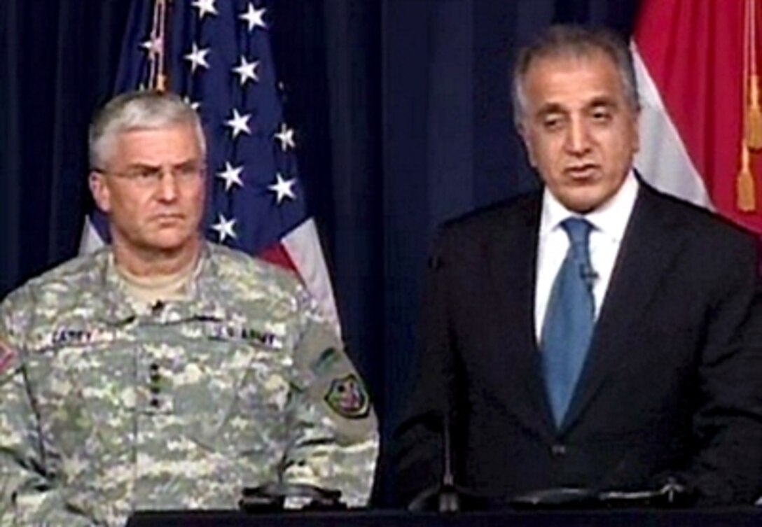Multi-National Force-Iraq Commanding General U.S. Army Gen. George W. Casey Jr. and  U.S. Ambassador to Iraq Zalmay Khalilzad conduct a joint press conference in Baghdad broadcast live in the Pentagon briefing room, Oct. 24.