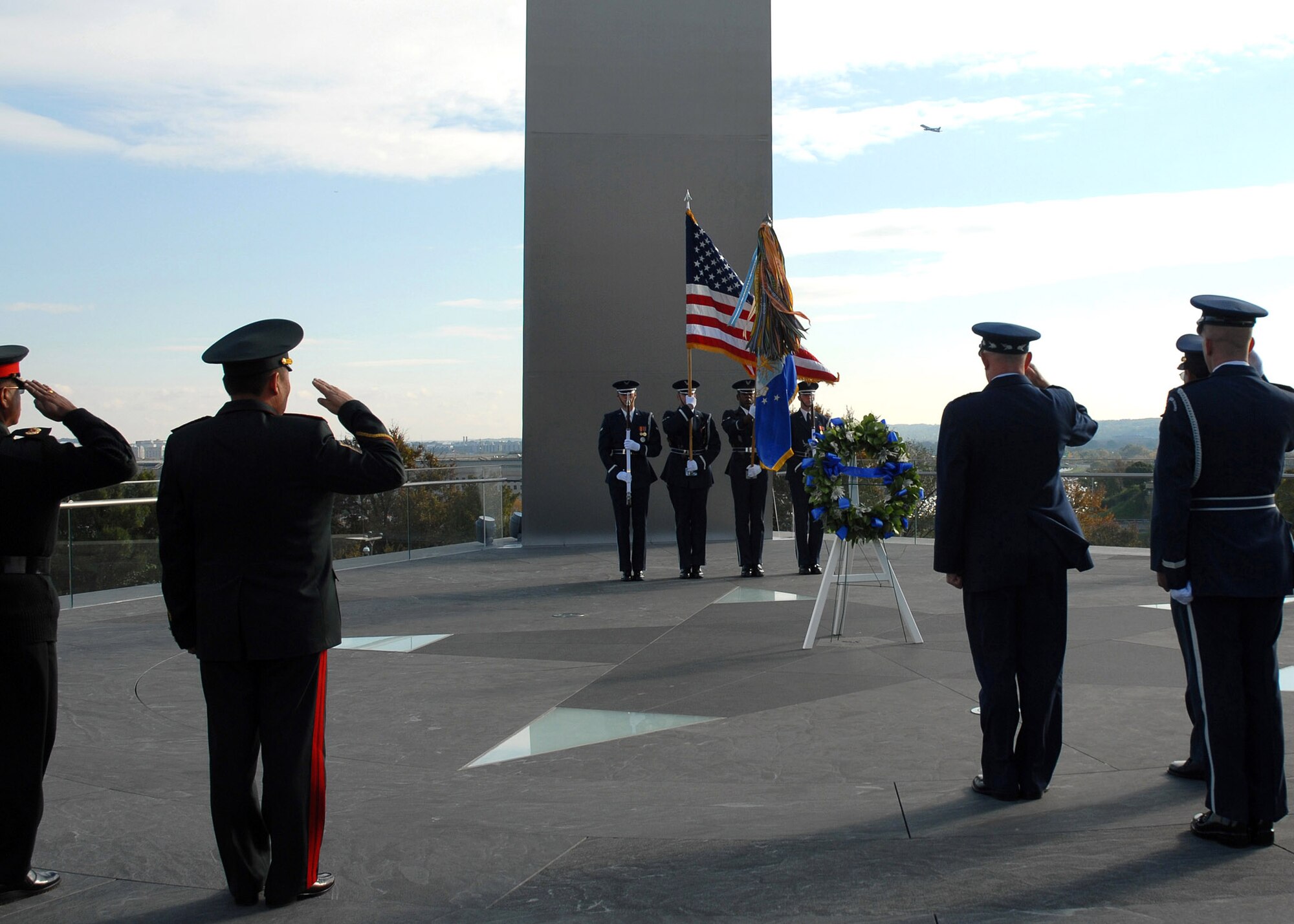 Chief of Staff of the Air Force Gen. T. Michael Moseley and Pacific Air Chiefs from Brunei, Cambodia, Canada, Chile, Japan, Mongolia, Nepal, New Zealand and the Philippines salute while Taps is played during a foreign dignitary arrival and wreath laying ceremony Tuesday, Oct. 24, 2006, at the Air Force Memorial.  (U.S. Air Force photo/Staff Sgt. Madelyn Waychoff)