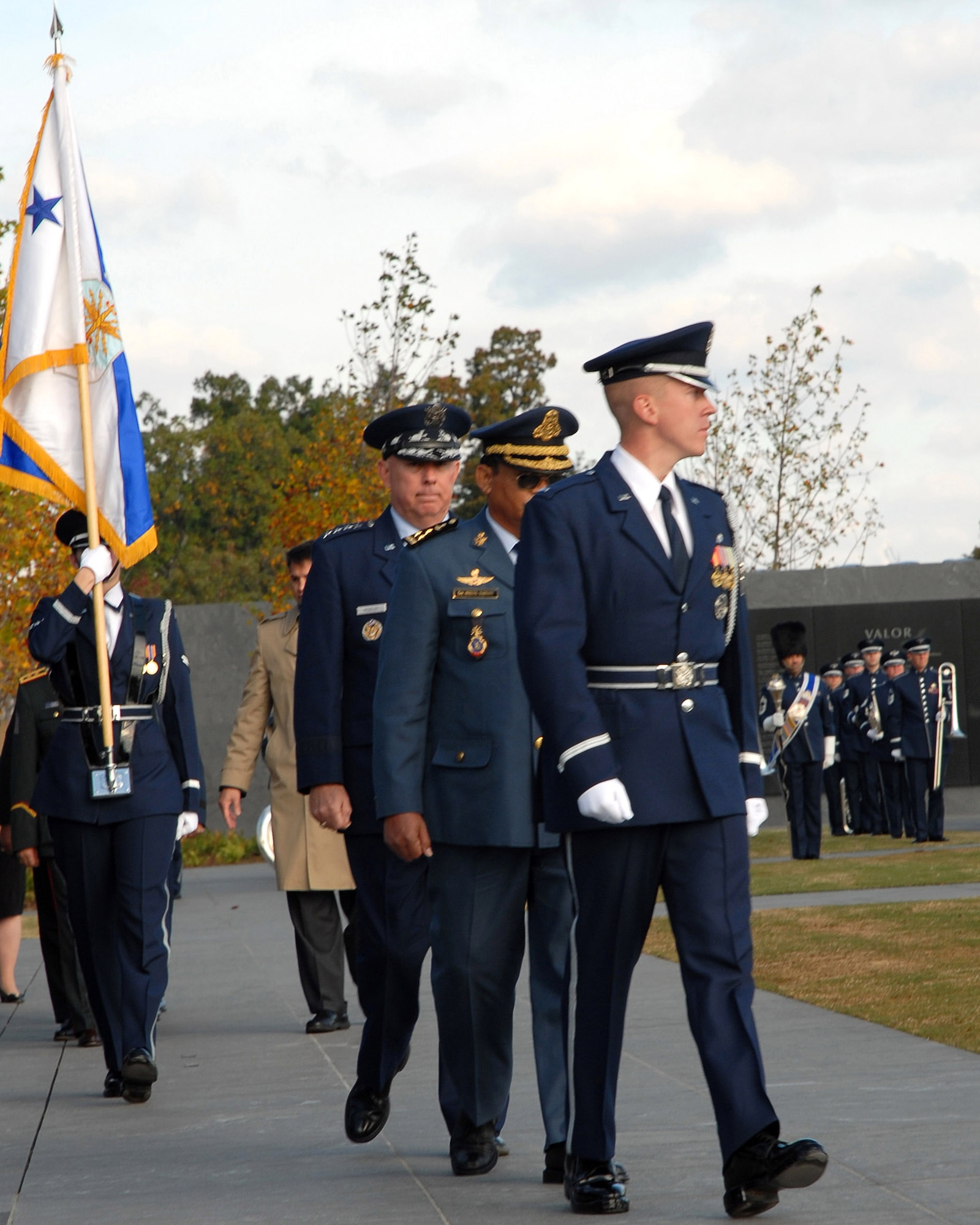 1st Lt. John Shirley from the Air Force Honor Guard leads Chief of Staff of the Air Force Gen. T. Michael Moseley and Lt. Gen. Soeung Samnang, Cambodian Royal Air Force commander, to the wreath during a foreign dignitary arrival and wreath laying ceremony Tuesday, Oct. 24, 2006, at the Air Force Memorial. (U.S. Air Force photo/Staff Sgt. Madelyn Waychoff)