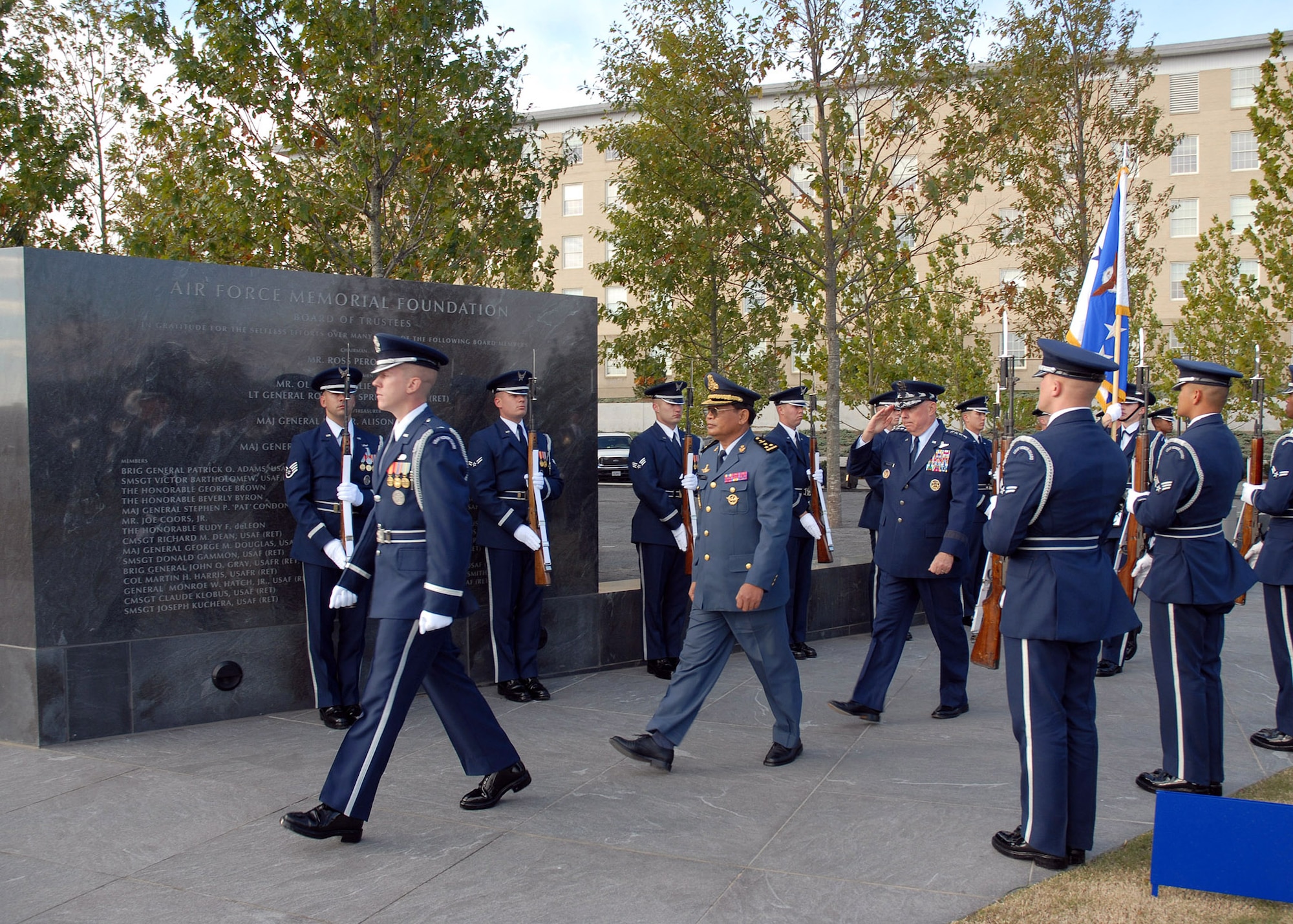 1st Lt. John Shirley from the Air Force Honor Guard escorts Chief of Staff of the Air Force Gen. T. Michael Moseley and Lt. Gen. Soeung Samnang, Cambodian Royal Air Force commander, to their positions during a foreign dignitary arrival and wreath laying ceremony Tuesday, Oct. 24, 2006, at the Air Force Memorial. (U.S. Air Force photo/Staff Sgt. Madelyn Waychoff)