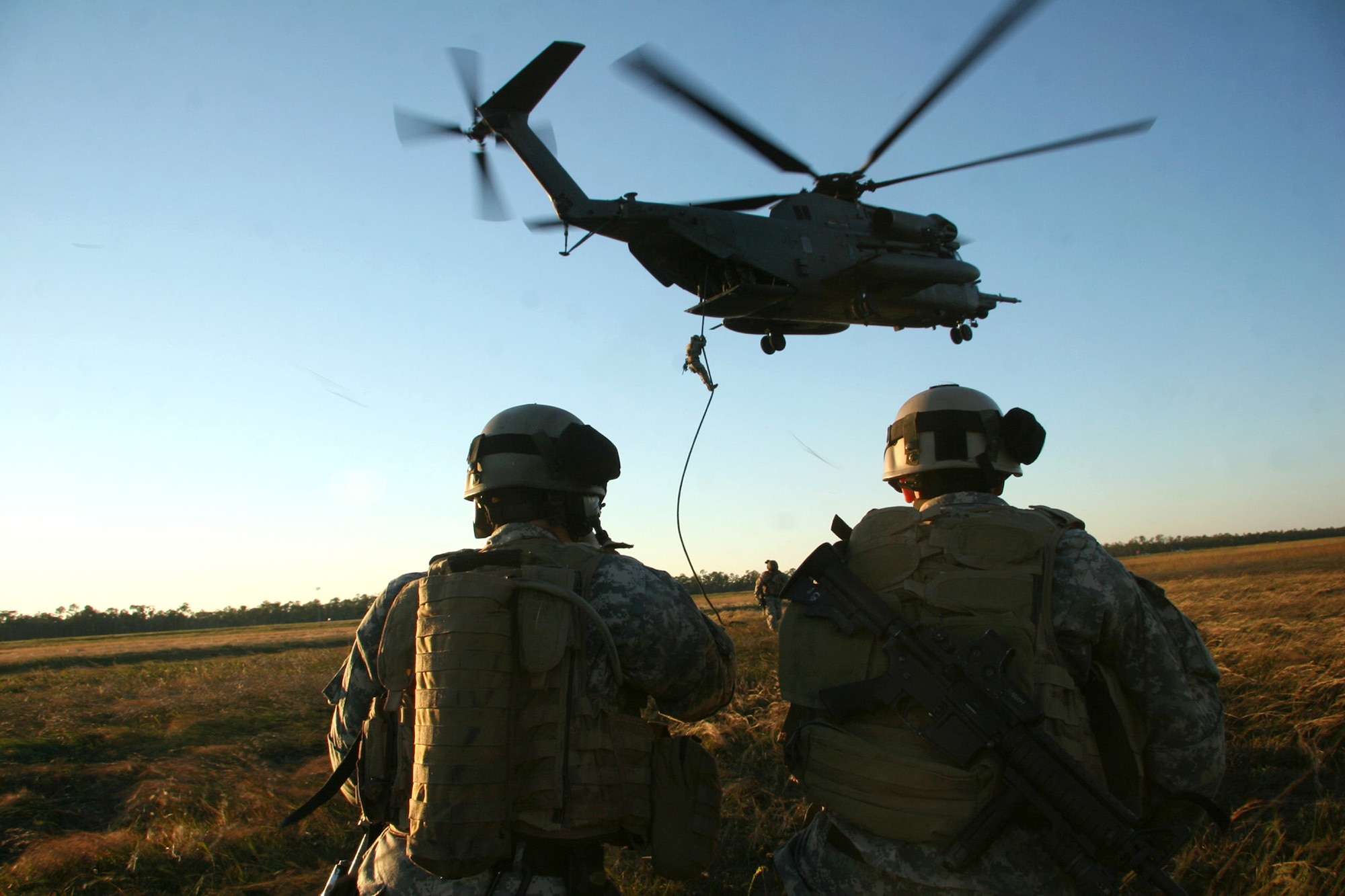 Special Forces Soldiers rehearse "fast-roping" insertions out of the rear of an Air Force MH-53 helicopter Oct. 23 at Hurlburt Field, Fla., in preparation for Emerald Warrior '07. The Air Force Special Operations Command's first joint coalition exercise will focus on training Air Force, Army and allied units in missions directly related to the war on terrorism. The exercise will operate from Oct. 25 to Nov. 3. (U.S. Army photo/Staff Sgt. Cain S. Claxton)