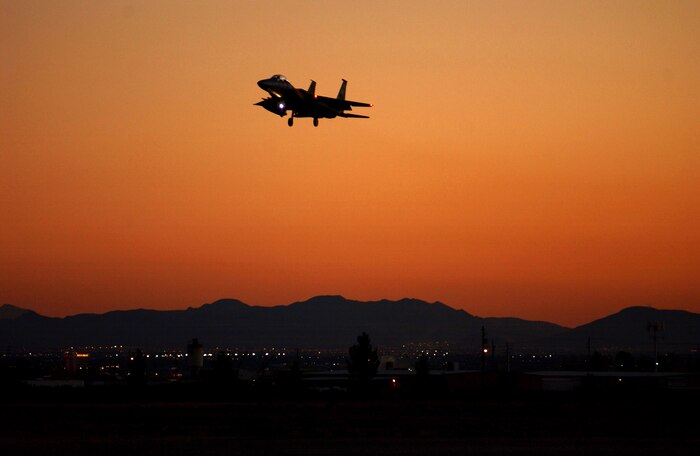 An F-15 participating in Exercise Red Flag 07-1 approaches Nellis Air Force Base, Nev., on Oct. 19, 2006.  Red Flag tests aircrews’ war-fighting skills in realistic combat situations. The aircraft fly missions during the day and night to the nearby Nevada Test and Training Range where they simulate an air war. U.S. service members, with representatives from each branch of service along with coalition forces, participate in Red Flag.  (U.S. Air Force photo/Airman First Class Brian Ybarbo)

