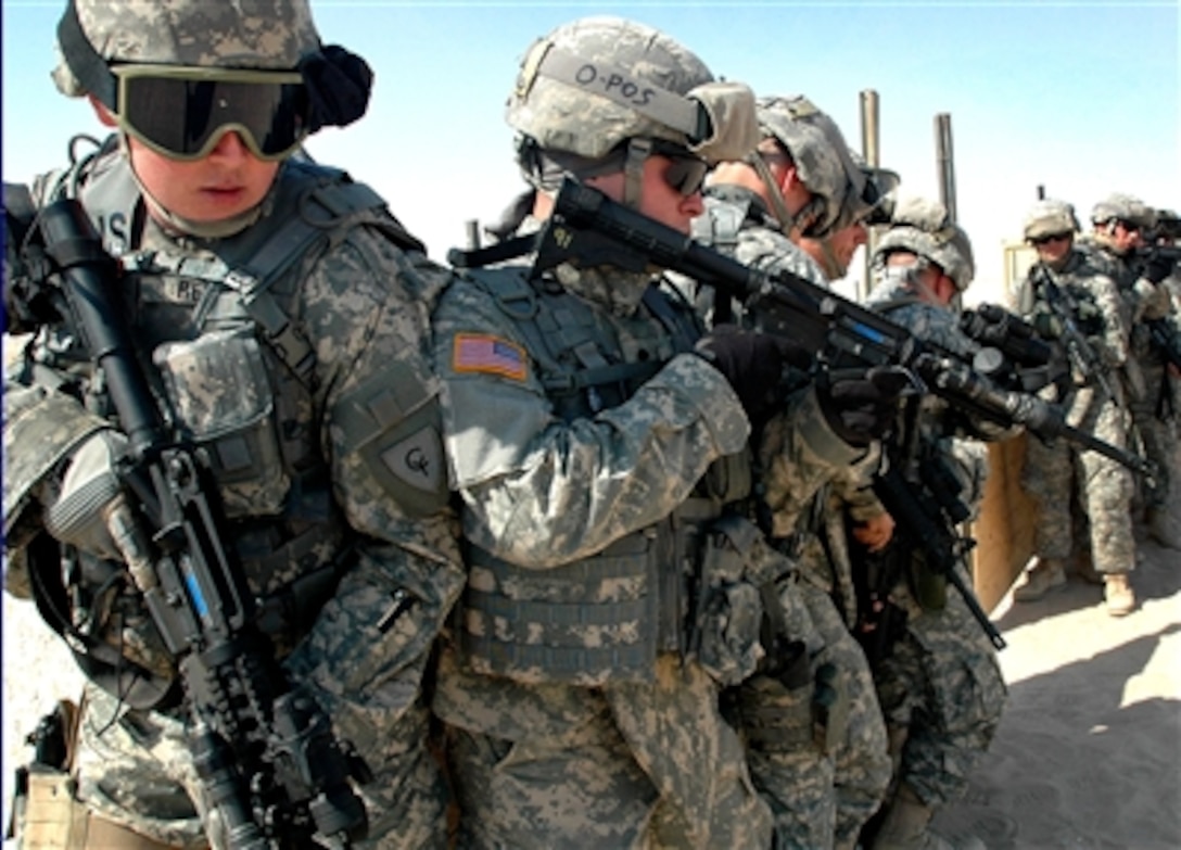 Soldiers with 2nd Battalion, 107th Cavalry Regiment, Ohio National Guard, practice cordon and search drills at the Military Operations on Urban Terrain facility in Camp Buehring, Kuwait, Oct. 23, 2006. 