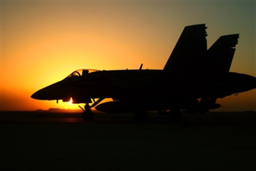 A Thunderbolt jet sits on the taxiway outside Marine Fighter Attack Squadron 251 before the day's flight schedule begins at Al Asad, Iraq, Oct. 25, 2006. The squadron is based at Marine Corps Air Station Beaufort, S. C.