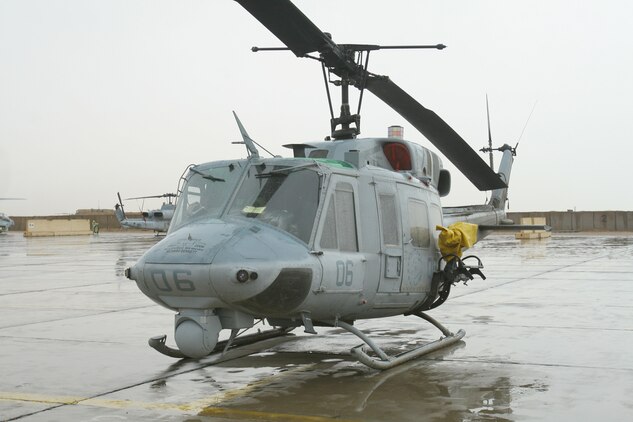An UH-1N Huey sits buttoned up on the flight line at Al Taqaddum, Iraq, Oct. 25. The helicopter belongs to Marine Light Attack Helicopter Squadron 367, Marine Aircraft Group 16 (Reinforced), 3rd Marine Aircraft Wing (Forward), which assumed responsibility for providing close air support and casualty evacuation escort missions from HMLA-169, MAG-16, 3rd MAW.