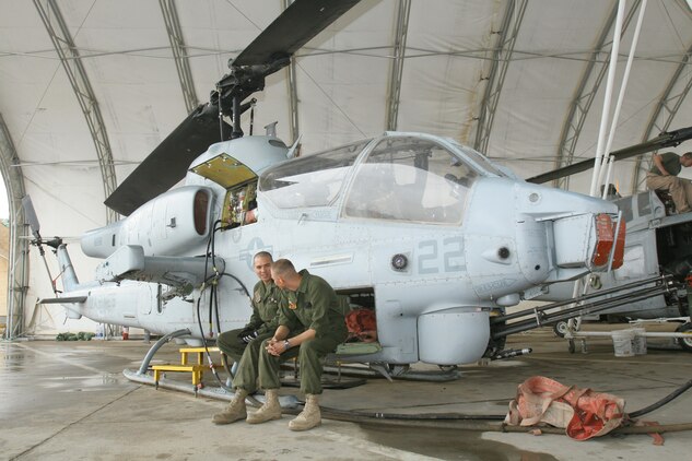 Cpl. Thomas P. Olsen troubleshoots the hydraulic system on an AH-1W Super Cobra at Al Taqaddum, Iraq, Oct. 25. Olsen is an UN/AH-1 helicopter airframe mechanics with Marine Light Attack Helicopter Squadron 367, Marine Aircraft Group 16 (Reinforced), 3rd Marine Aircraft Wing (Forward), which assumed responsibility for providing close air support and casualty evacuation escort missions from HMLA-169, MAG-16, 3rd MAW. Olsen is a San Diego native.