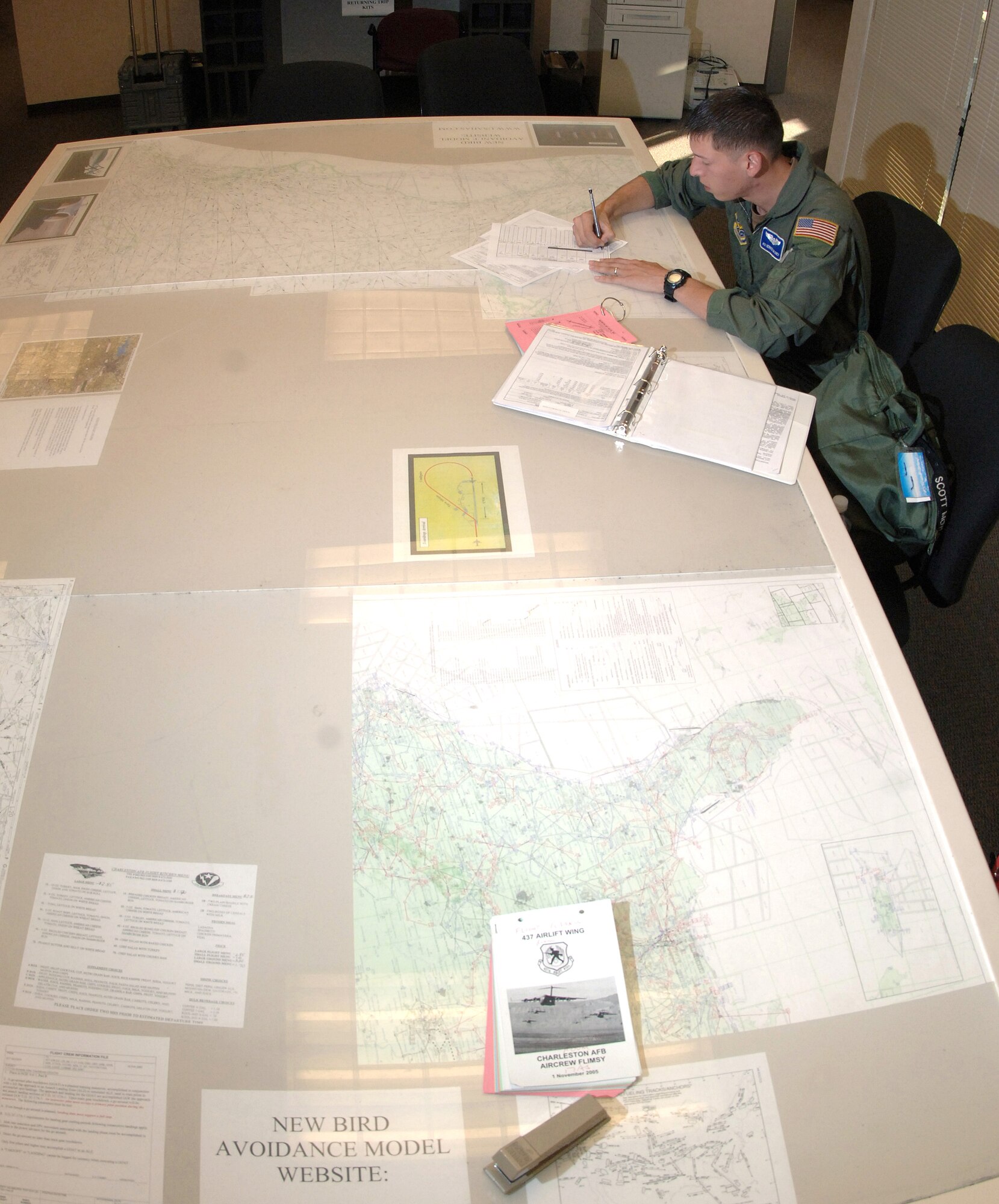 Airman 1st Class Derrick Maloney reviews mission history prior to his C-17 Globemaster III training mission Oct. 26 at Charleston Air Force Base, S.C. Airman Maloney is a loadmaster with the 17th Airlift Squadron. (U.S. Air Force photo/Tech. Sgt. Larry A. Simmons)