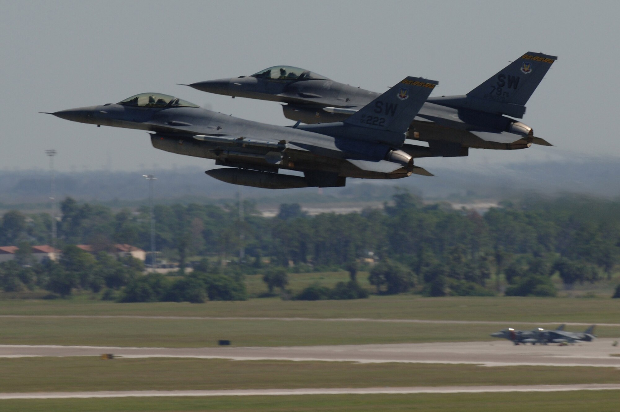 Two F-16 Fighting Falcons take off from MacDill Air Force Base, Fla., for an Atlantic Strike exercise mission Oct. 24.  The fighters, from the 20th Fighter Wing at Shaw AFB, S.C., were at MacDill for the U.S. Central Command bi-annual Atlantic Strike training event.  Through realistic close-air support training, Atlantic Strike is designed to better prepare aircrews and Air Force joint tactical air controllers for deployments.  (U.S. Air Force photo/Senior Airman Jason Robertson)