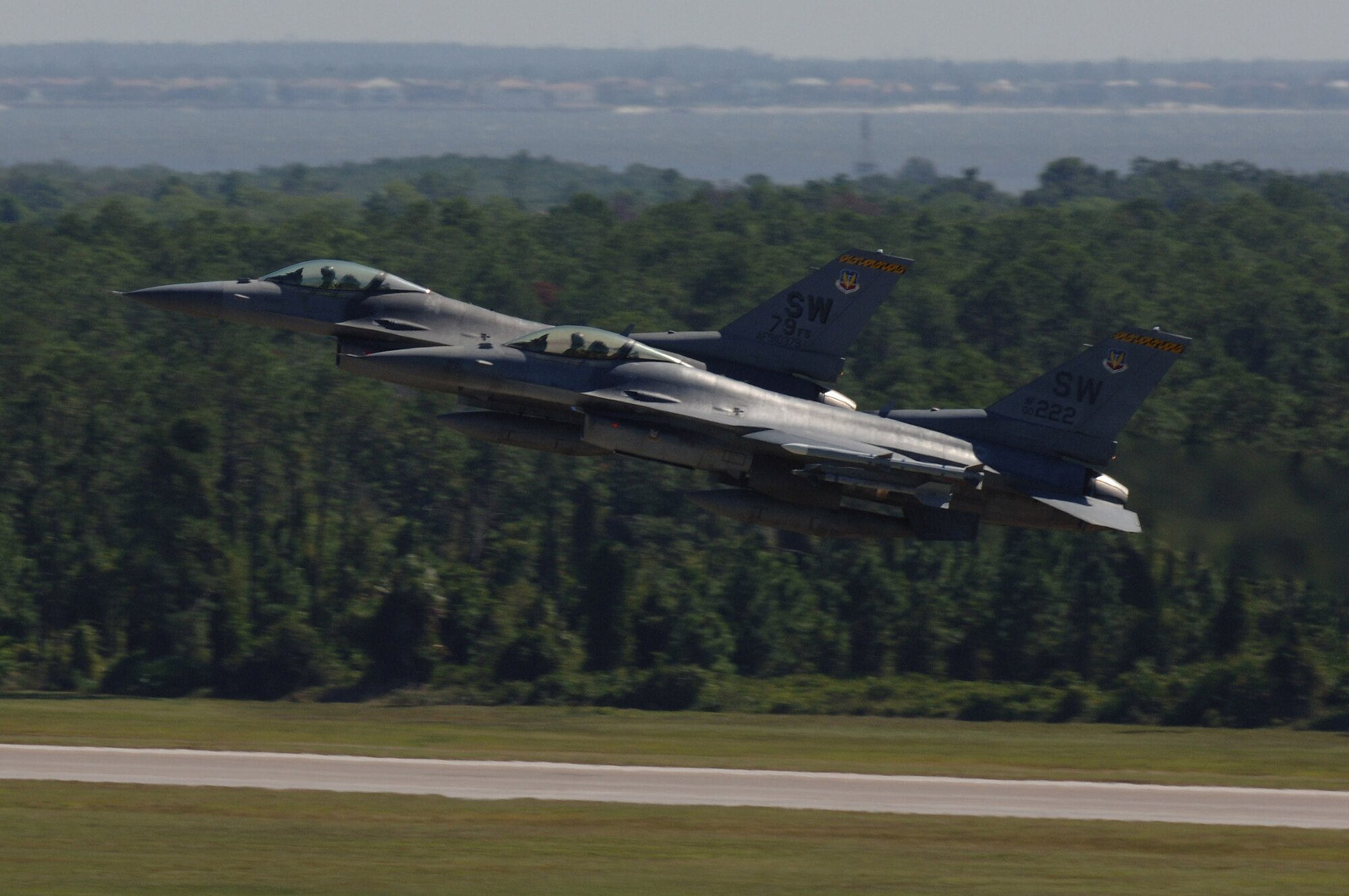Two F-16 Fighting Falcons take off from MacDill Air Force Base, Fla., for an Atlantic Strike exercise mission Oct. 24.  The fighters, from the 20th Fighter Wing at Shaw AFB, S.C., were at MacDill for the U.S. Central Command bi-annual Atlantic Strike training event.  Through realistic close-air support training, Atlantic Strike is designed to better prepare aircrews and Air Force joint tactical air controllers for deployments.  (U.S. Air Force photo/Senior Airman Jason Robertson)