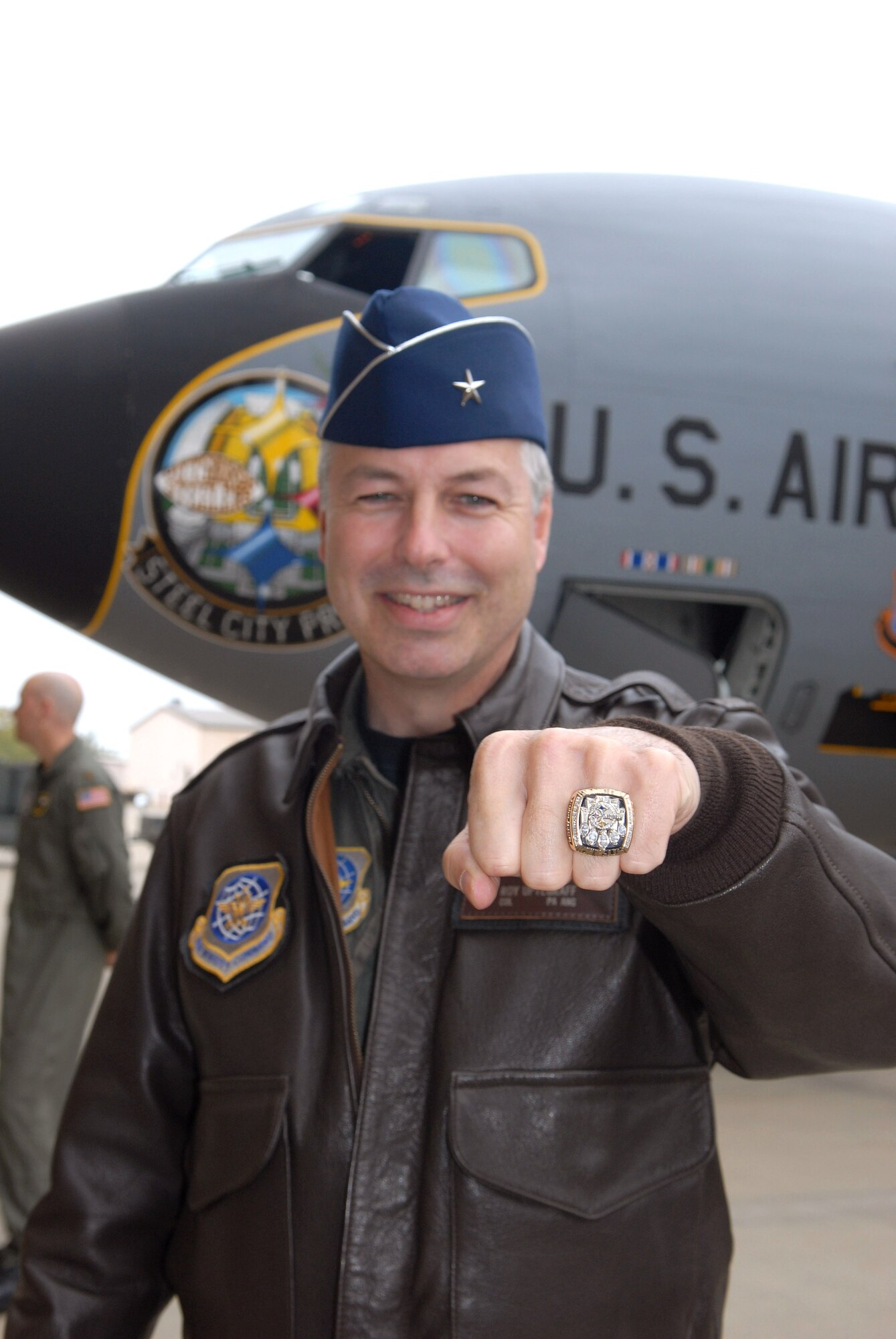 Brig. Gen. Roy Uptegraff tries on a Pittsburg Steeler Super Bowl ring Oct. 18.  Members of the football organization along with residents from the nearby Allegheny Valley School were on hand to help the Airmen of the Pennsylvania Air National Guard's 171st Air Refueling Wing christen the new "Steel City Pride" nose art on the unit's KC-135 Stratotankers.  General Uptegraff is the 171st ARW commander.  (U.S. Air Force photo/Master Sgt. Ann Young)