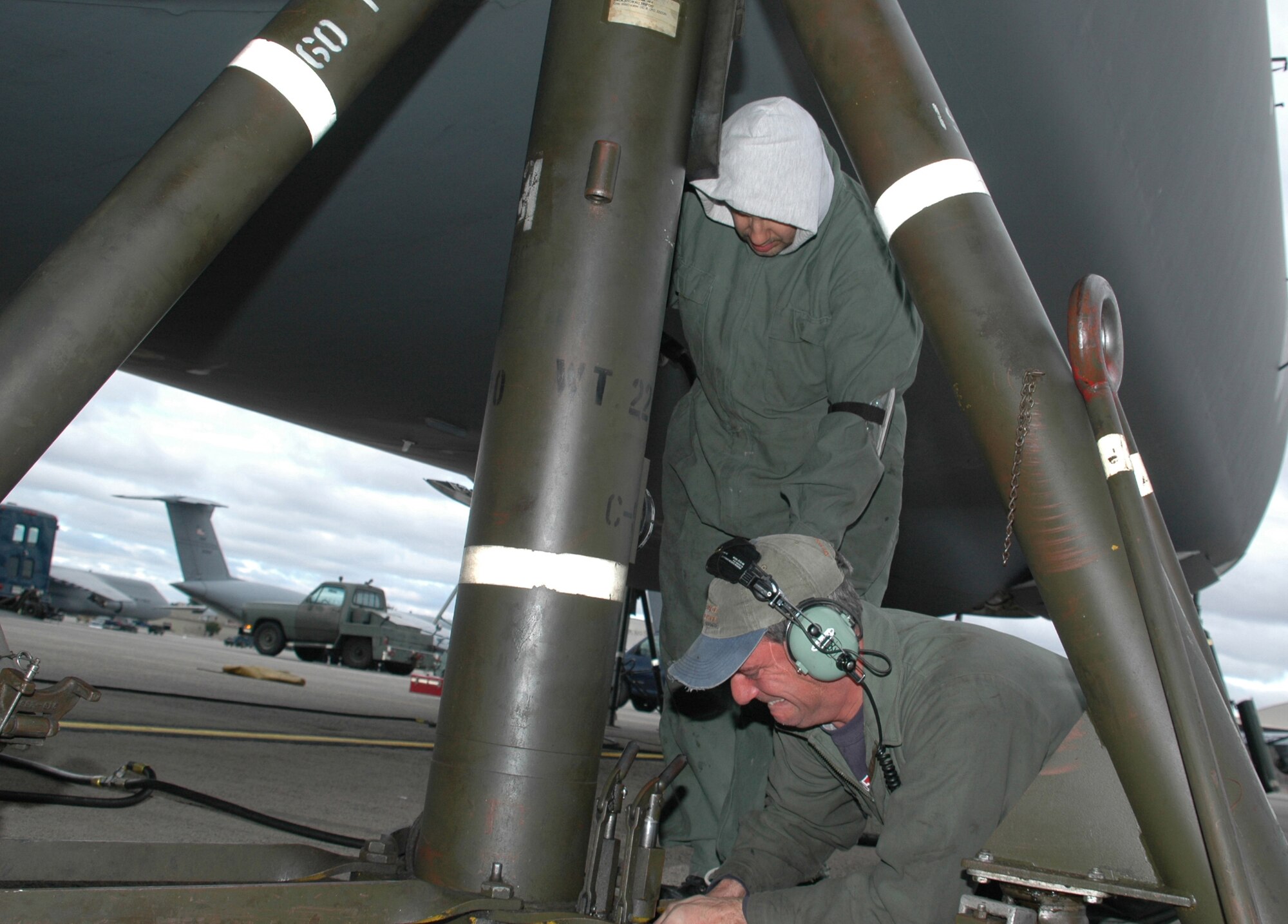 Rick Lavigne and Dave Iarossi, maintenance technicians with the aero repair shop of the 439th Maintenance Squadron, Westover Air Reserve Base, Mass., prepare to put a C-5 Galaxy on jacks at the base. Mr. Lavigne and Mr. Iarossi are air reserve technicians with the Air Force Reserve's 439th Airlift Wing at Westover, which includes more than 2,500 reservists and 16 C-5 aircraft.