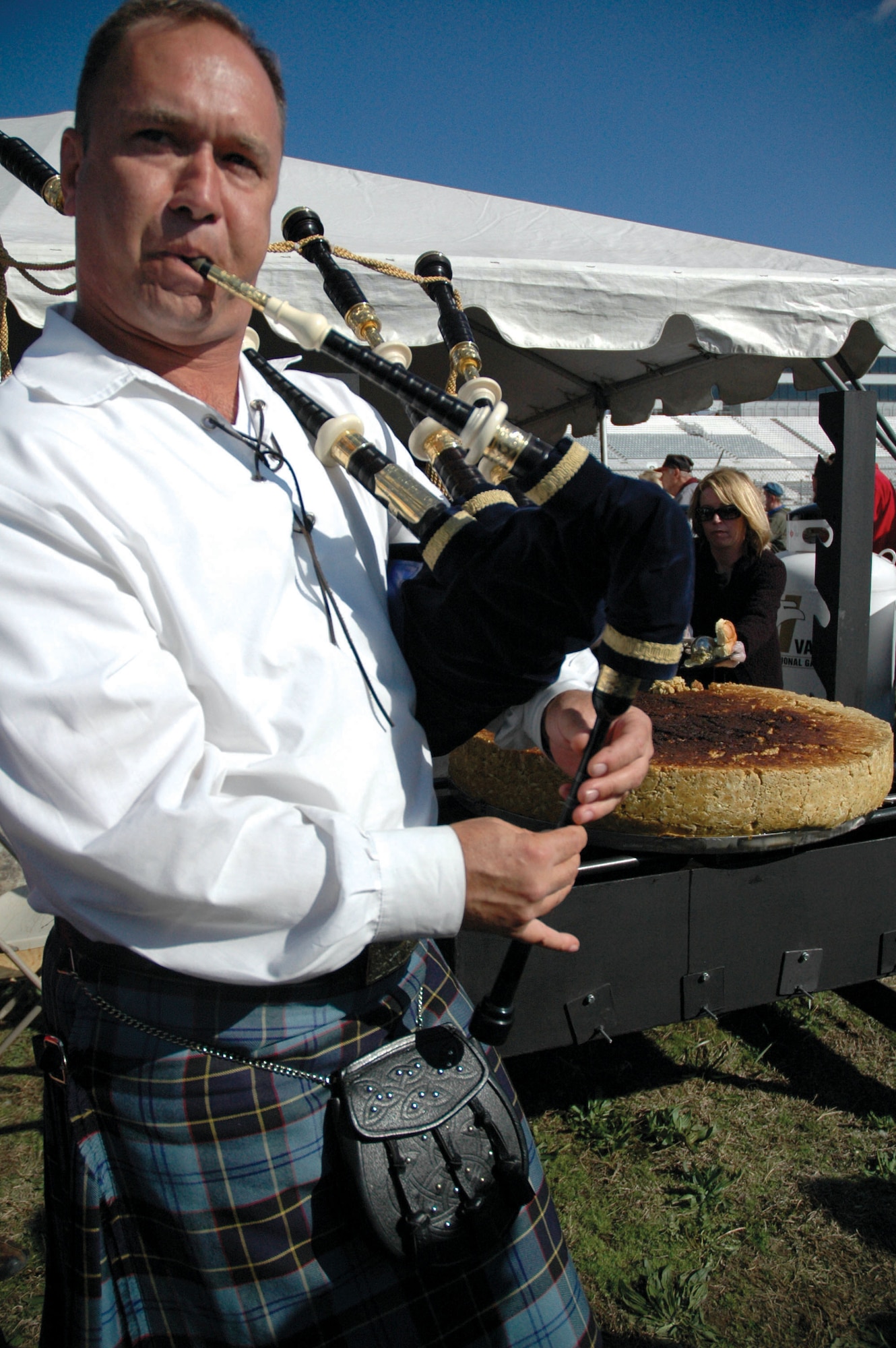Master Sgt. Scott Gunn, a member of the Air Force Reserve band Southern Aire, plays the bagpipes during the Guinness Book of World Records' certification of the world's largest crab cake, which weighed in at a record-breaking 235 pounds. The event took place at a national barbeque cook off in Dover, Del. Southern Aire was one of three bands that played at several locations throughout Delaware as part of the 512th Airlift Wing's Band Strike Package. (U.S. Air Force Photo/Tech. Sgt. Veronica A. Aceveda)