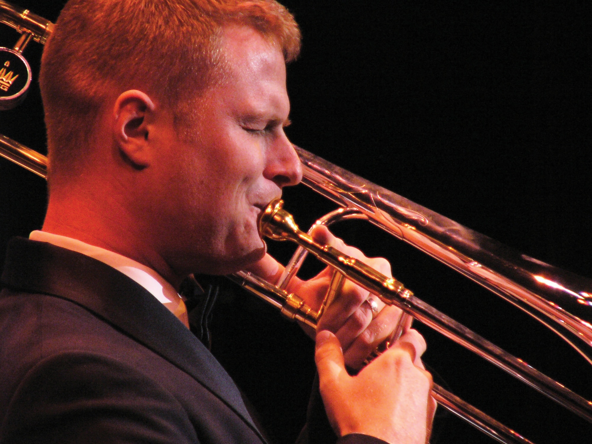 Airman 1st Class Rob Hyatt, trombone player for the Air Force Reserve Band Full Spectrum, plays for 200 people at the Schwartz Center, Dover, Del., Oct. 20. The 13-piece jazz band was one of three bands to visit Dover as part of a Band Strike Package. (U.S. Air Force Photo/Tech. Sgt. Charlie Anderson)