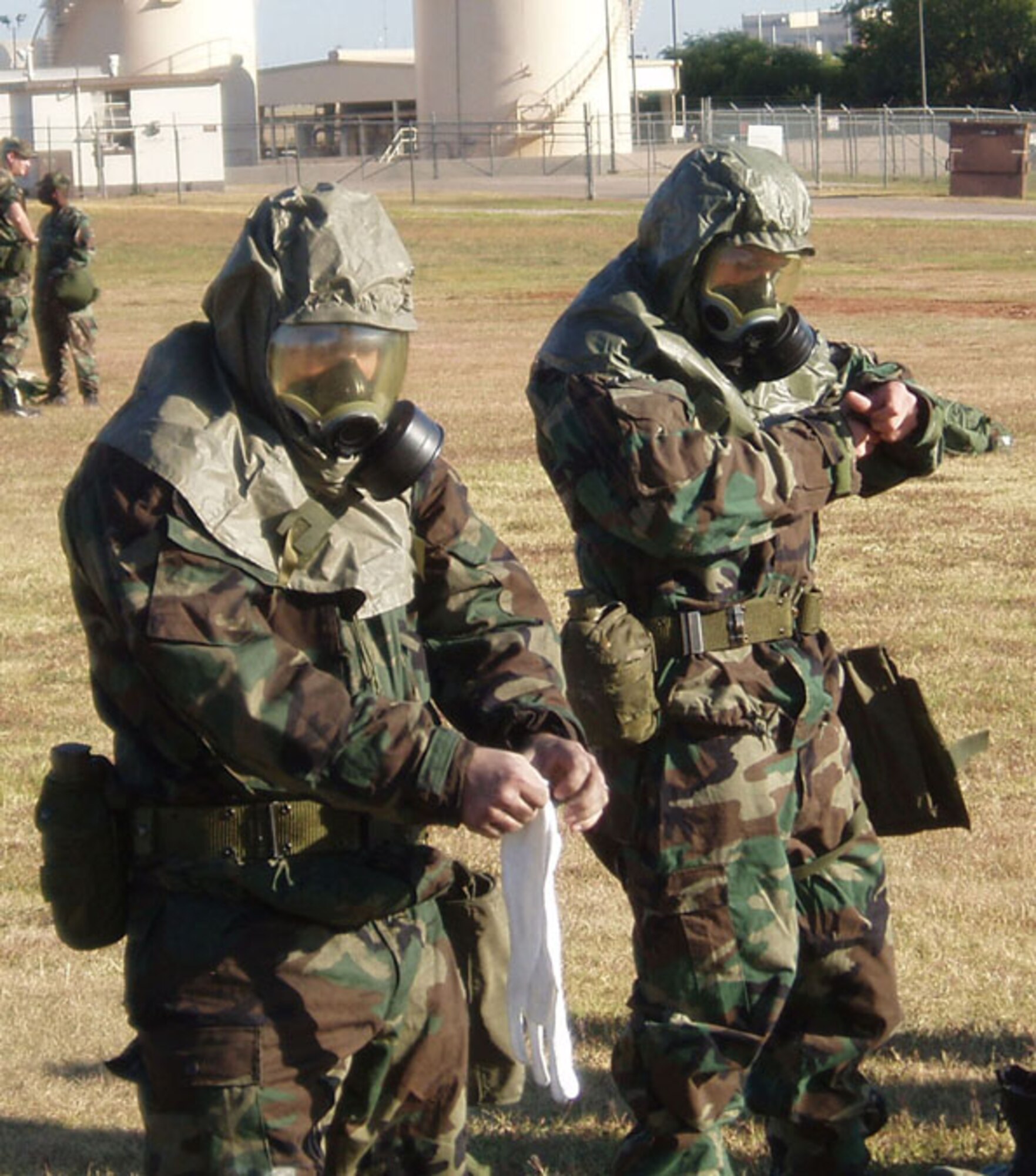 507th Air Refueling Wing members don their chemical protective gear during the October drill weekend while attending an Ability To Survive and Operate Fair.  The ATSO Fairs are being hosted by wing Exercise Evaluation Team members in preparation to the wing's 2007 Oerational Readiness Inspection.  While at ATSO Fair members visit various stations to refresh their skills on Self Aid Buddy Care, facility hardening and management techniques.  