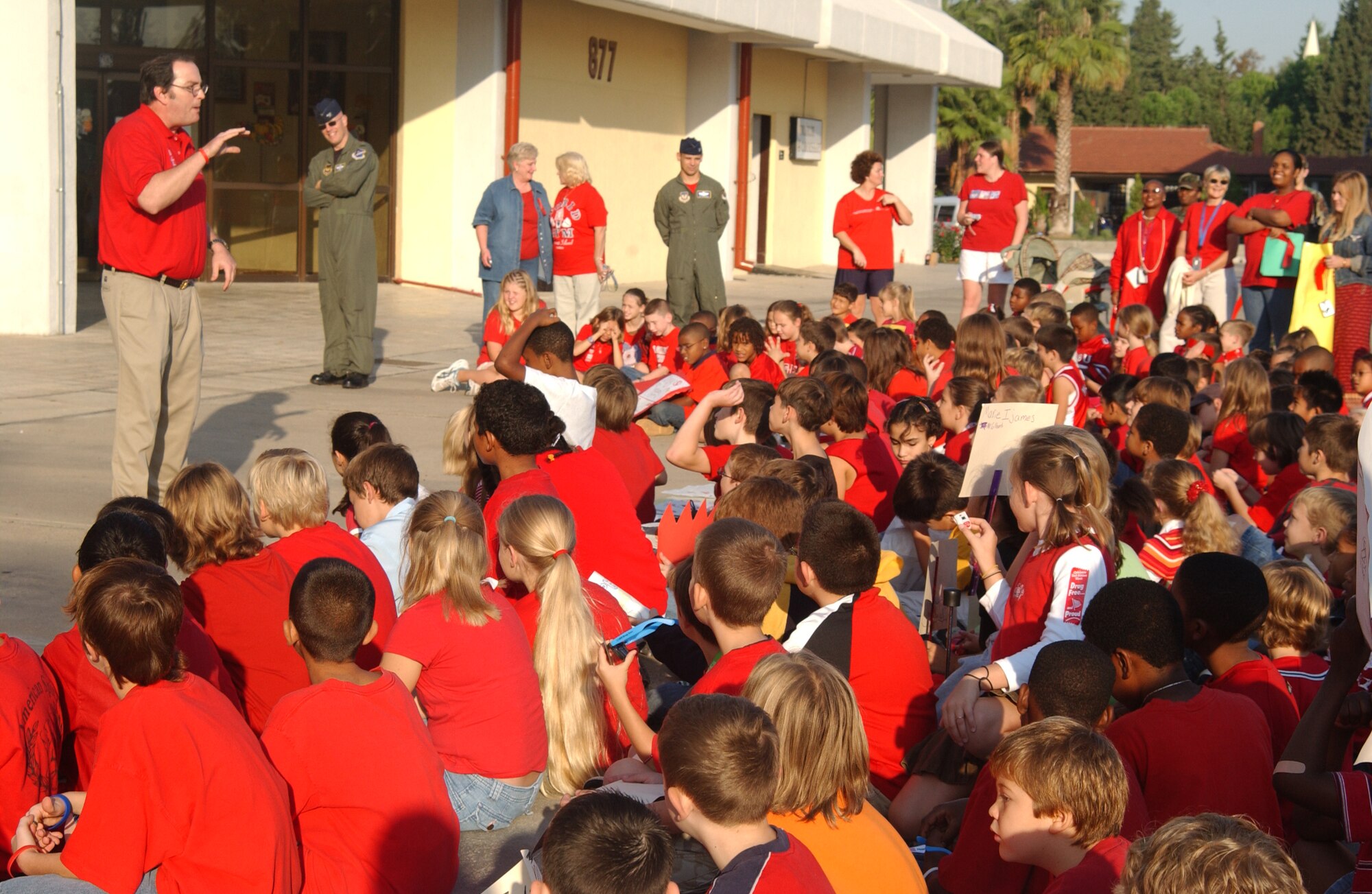 Kerry Bringman, 39th Medical Group drug demand reduction program manager, talks to Incirlik American School elementary school students about the dangers of drugs after the Red Ribbon Week parade Oct.  26.
