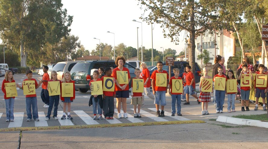 Incirlik American School elementry students participating in the Red Ribbon Week parade hold up their "We Don't Do Drugs" sign for the crowd to see Oct. 26. (U.S. Air Force photo by Airman 1st Class Tiffany Coulburn) 