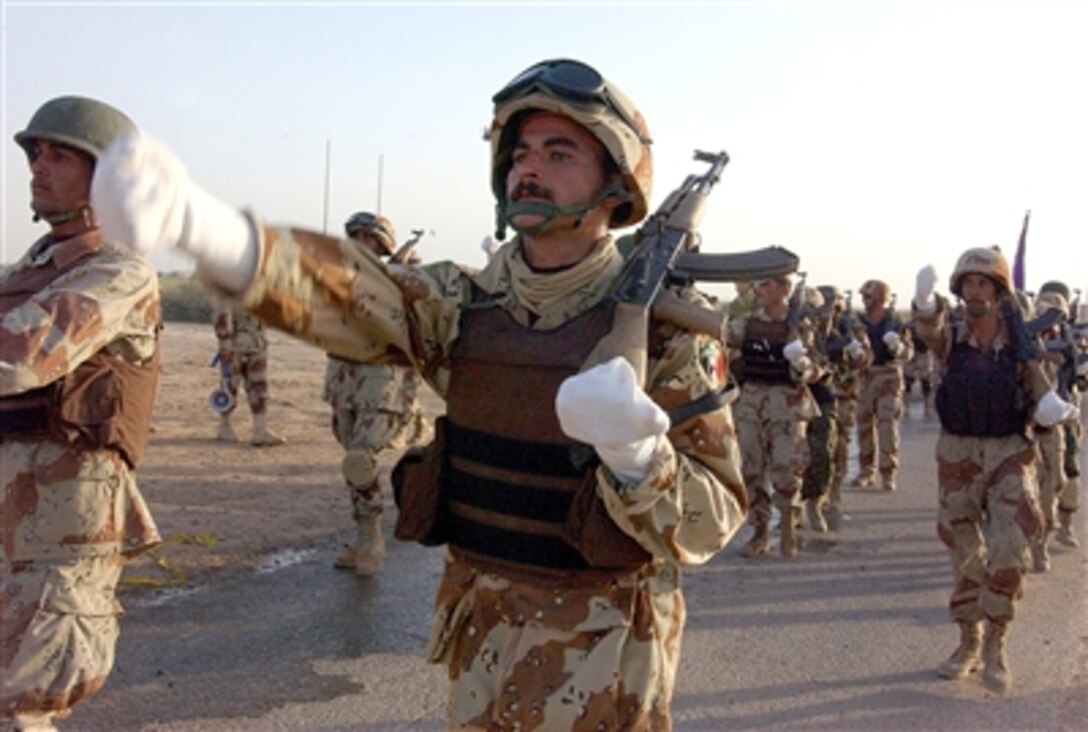 Iraqi soldiers march during a ceremony to assume responsibility for an area of operations near Forward Operating Base O’Ryan, Oct. 25, 2006. The Iraqis took control from U.S. soldiers of the 4th Infantry Division. 