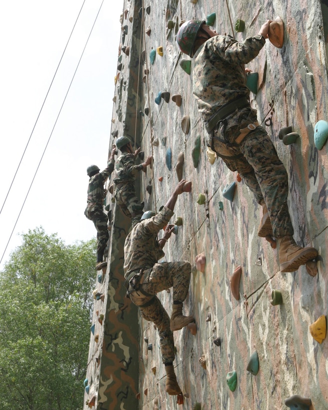 BELGAUM, India (Oct. 27, 2006) - Marines with 1st Platoon, Echo Co., Battalion Landing Team 2/4, and soldiers with India army's Alpha Co., 21st Battalion, The Punjab Regiment, participate in rock climb training here. Marines of Echo Co. are participating in Exercise Shatrujeet 06, which began 25 October 2006 where they are currently training with the Indian Army in basic infantry tactics. The 15th Marine Expeditionary Unit (Special Operations Capable), part of the Boxer Expeditionary Strike Group aboard the USS Boxer (LHD 4), USS Dubuque (LPD 8) and the USS Comstock (LSD 45), is currently deployed in the Western Pacific region.
