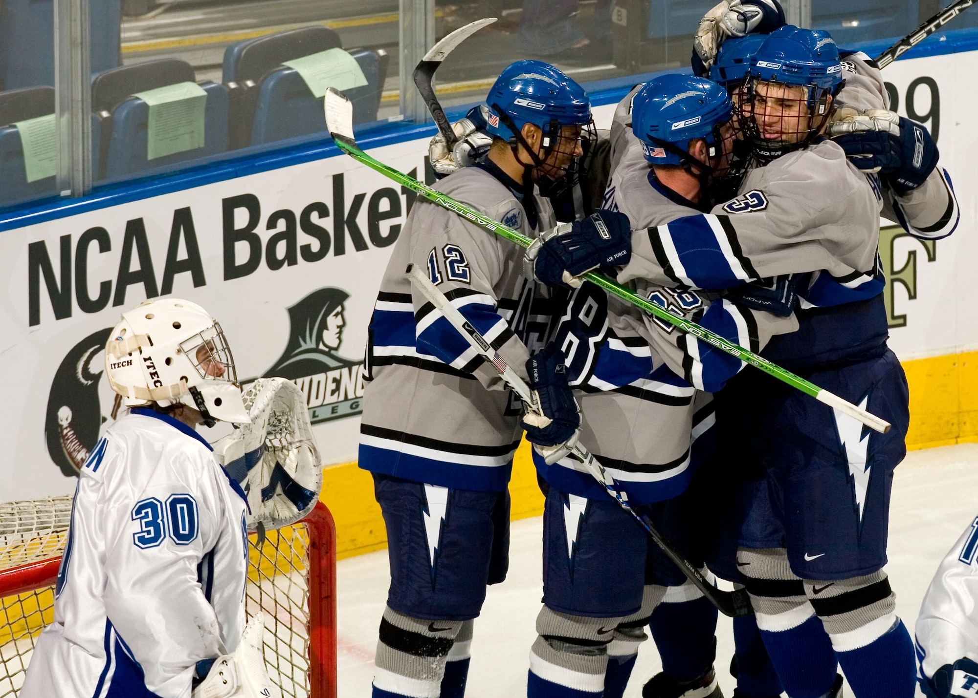 Air Force celebrates after freshman Jeff Hajner scored his first career goal to give the Falcons a 5-3 lead in the second period. Air Force went on to win the game, 7-5, and advance to the championship game. (U.S. Air Force photo/Scott Audette)