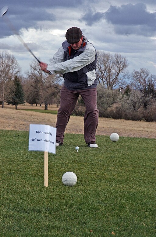 Col. Michael Carey, 90th Space Wing commander, tees off during the Warren Spouse's Club Scholarship Scramble Oct. 20 at the Warren Golf Course.  The event raised more than $800 for the scholarship fund. 