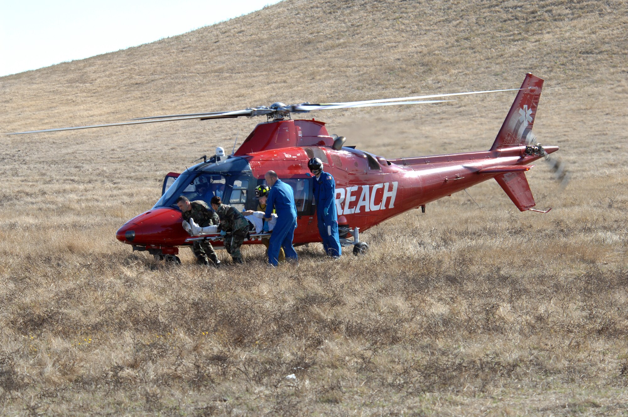 “Victims” are airlifted out of the aircraft crash site during the Exercise "Aircraft Down," Oct. 19. Helicopter rescue organizations CALSTAR, Life Flight and REACH also took part in the exercise, flying them to local hospitals. (U.S. Air Force photo by Nan Wylie) 