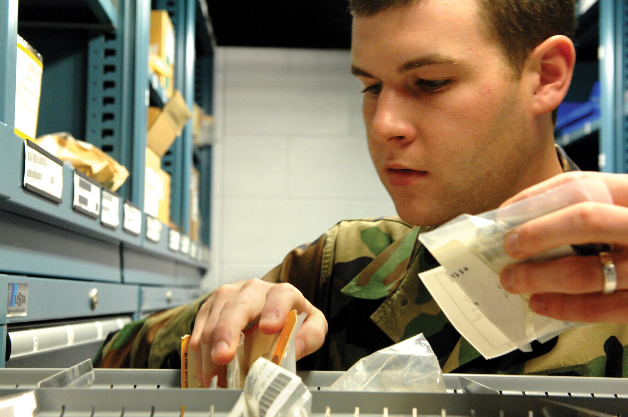 McChord Air Force Base, Wash.-- 
Airman 1st Class Roy Bayne, 62nd Logistics Readiness Squadron, organizes a parts drawer during a routine inventory count.
(U.S. Air Force photo/Abner Guzman)