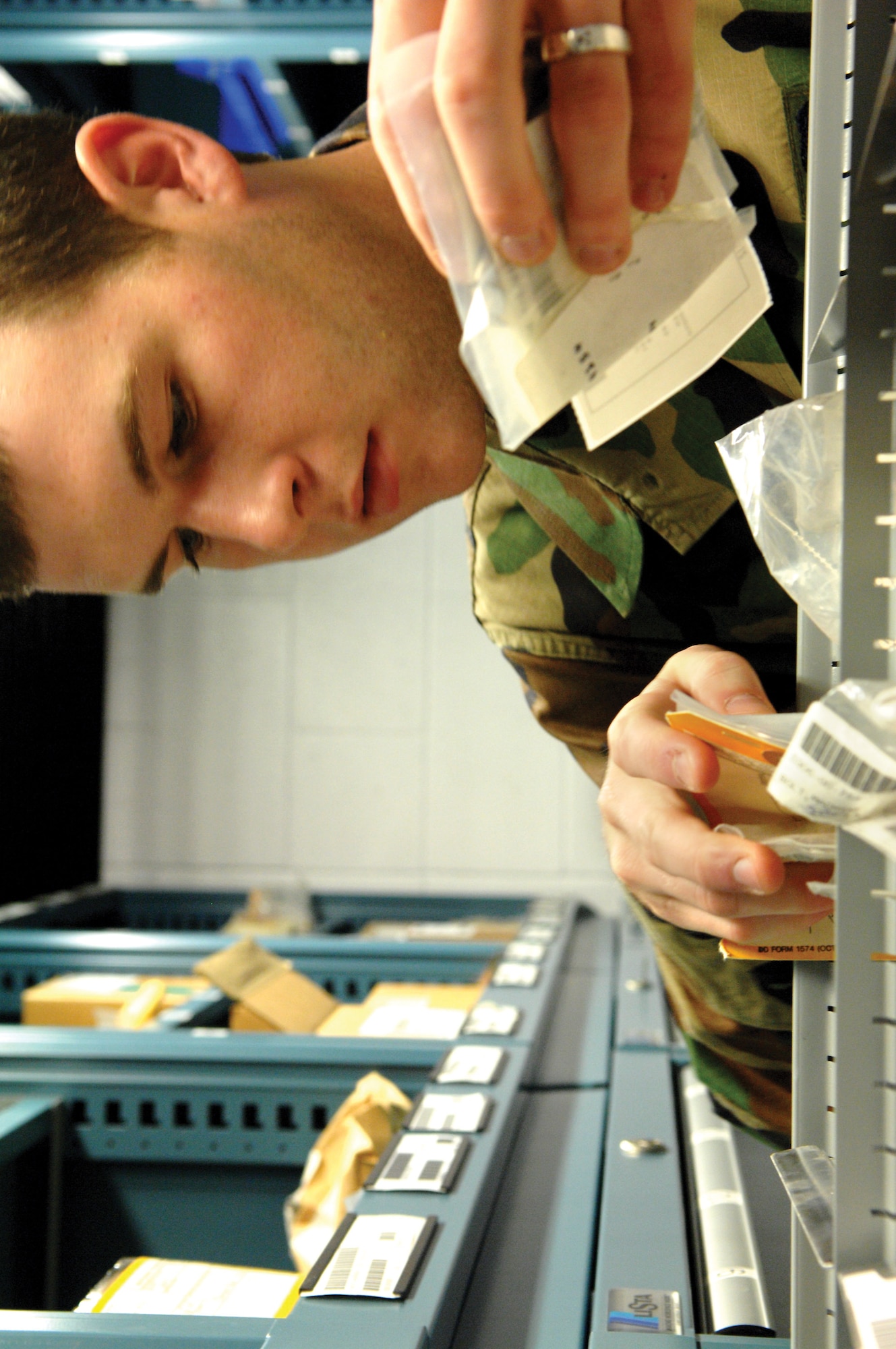 McChord Air Force Base, Wash.-- 
Airman 1st Class Roy Bayne, 62nd Logistics Readiness Squadron, organizes a parts drawer during a routine inventory count.
(U.S. Air Force photo/Abner Guzman)