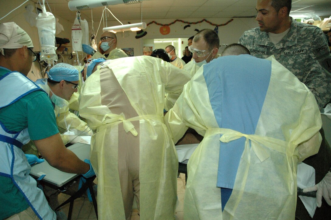 The 506th Expeditionary Medical Squadron staff cares for two patients who were injured by an improvised explosive device while on patrol Oct. 18. (U.S. Air Force photo/Staff Sgt. Sonya Kenck)
