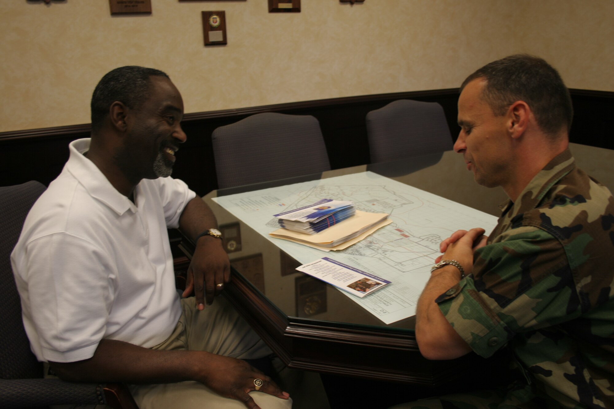 Vernon A. Reddick, left, 39th Air Base Wing school liasion officer, talks with Col. Ken Stefanek, 39th ABW vice commander, about various subjects ongoing at Incirlik American School on Oct. 27. Mr. Reddick was the inagural winner of the Department of Defense Education Activity Military Unity Commander Excellence Award. (U.S. Air Force photo by Staff Sgt. Oshawn Jefferson)