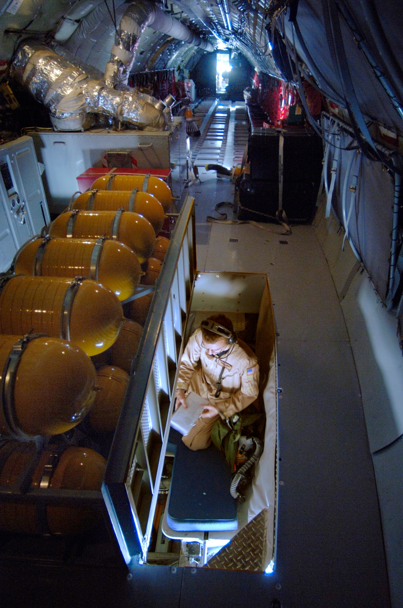 Senior Airman Jered Danielson pauses to review a checklist before crawling into the boom pod of the KC-135R Stratotanker. As a boom operator, he helps extend the capability and range of all the aircraft he refuels. Airman Danielson is an in-flight refueling journeyman assigned to the 340th Expeditionary Air Refueling Squadron. He is deployed to Southwest Asia from the 911th Air Refueling Squadron at Grand Forks Air Force Base, N.D. (U.S. Air Force photo/Master Sgt. D. Scott Wagers)